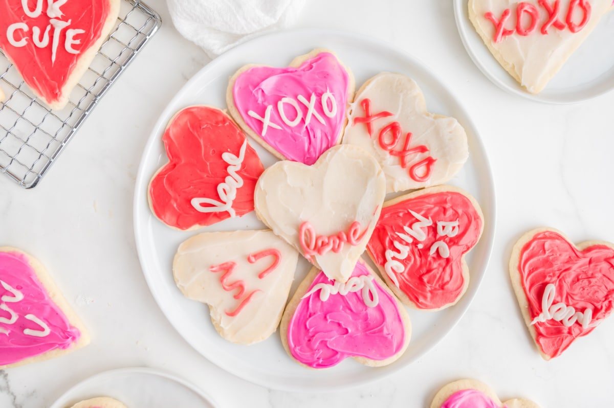 Heart Shaped Sugar Cookies ready to eat A variety of decorated heart sugar cookies spread out on a cooling rack, ready to be enjoyed.