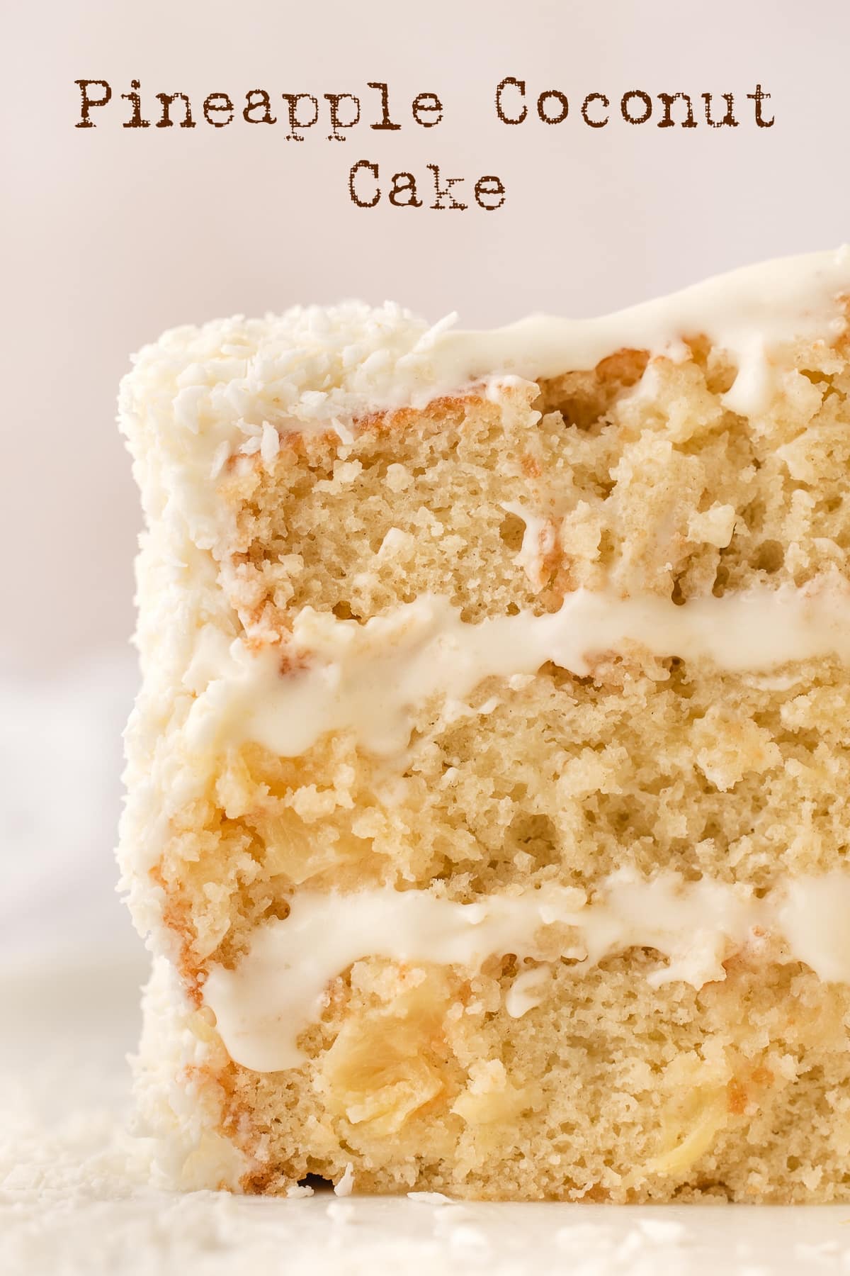 This pineapple coconut cake recipe is a tropical-flavored dream dessert. It's the perfect blend of sweet pineapple and nutty coconut in every bite. This easy and from scratch, three layered pineapple coconut cake is topped with a coconut cream cheese frosting and shredded coconut. This cake is reminiscent of a pina colada cake and is perfect for spring or summer dessert and a great Easter dessert too. via @cmpollak1