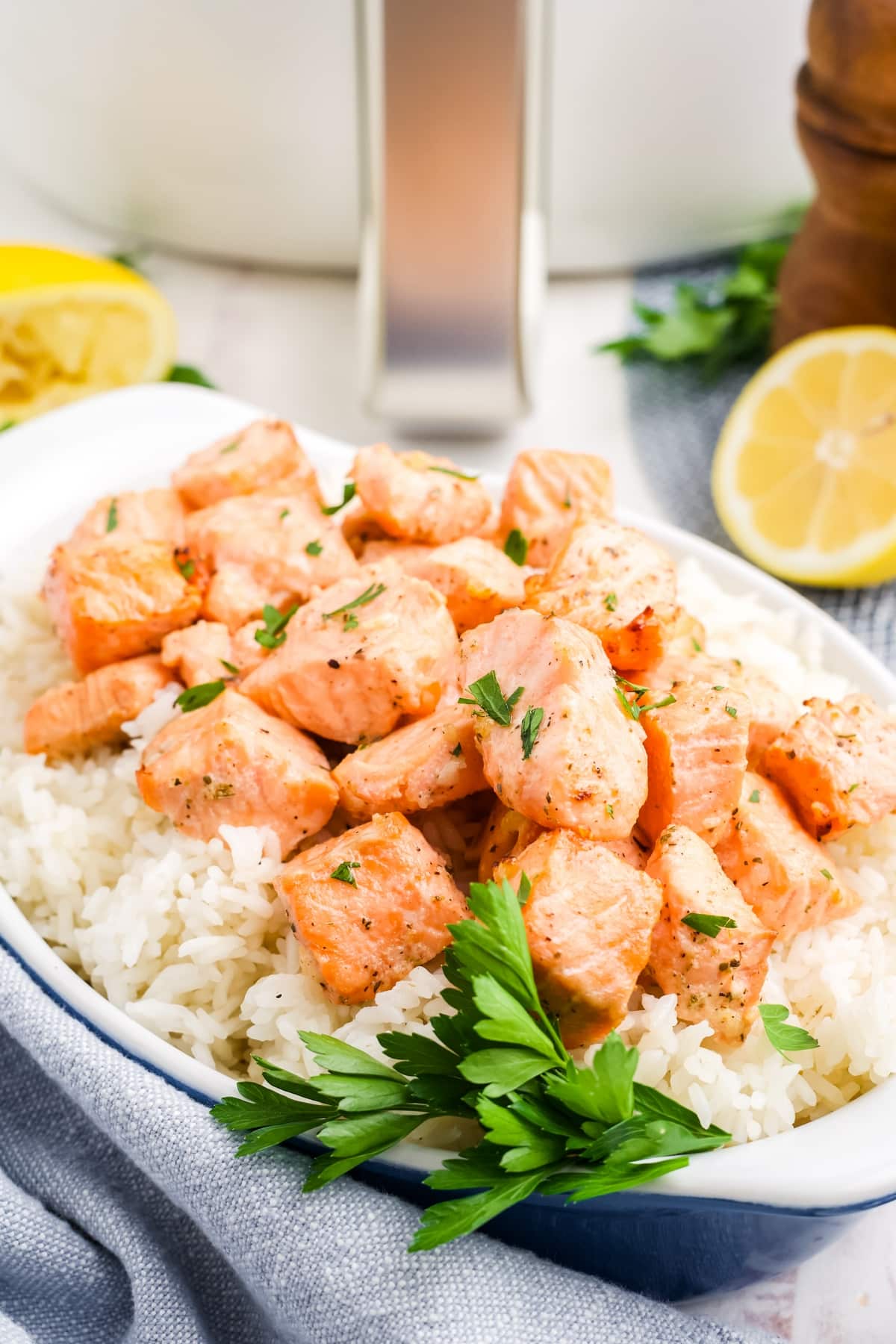 Air Fryer Salmon Bites ready to eat air fryer salmon bites over rice in a white dish