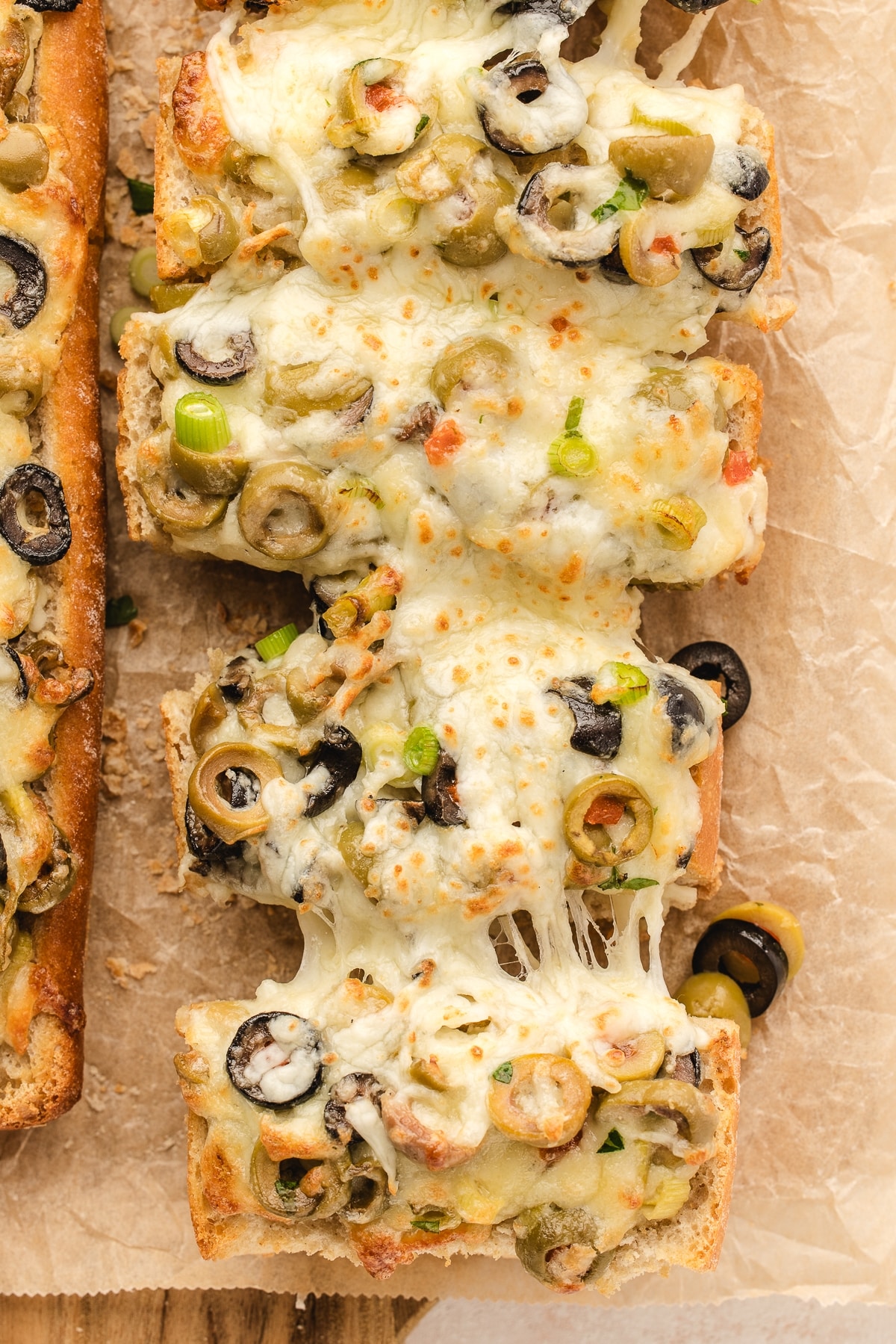 Indulge in this irresistible olive cheese bread recipe. Perfect as a party appetizer or a side dish for your favorite main course. olive cheese bread
