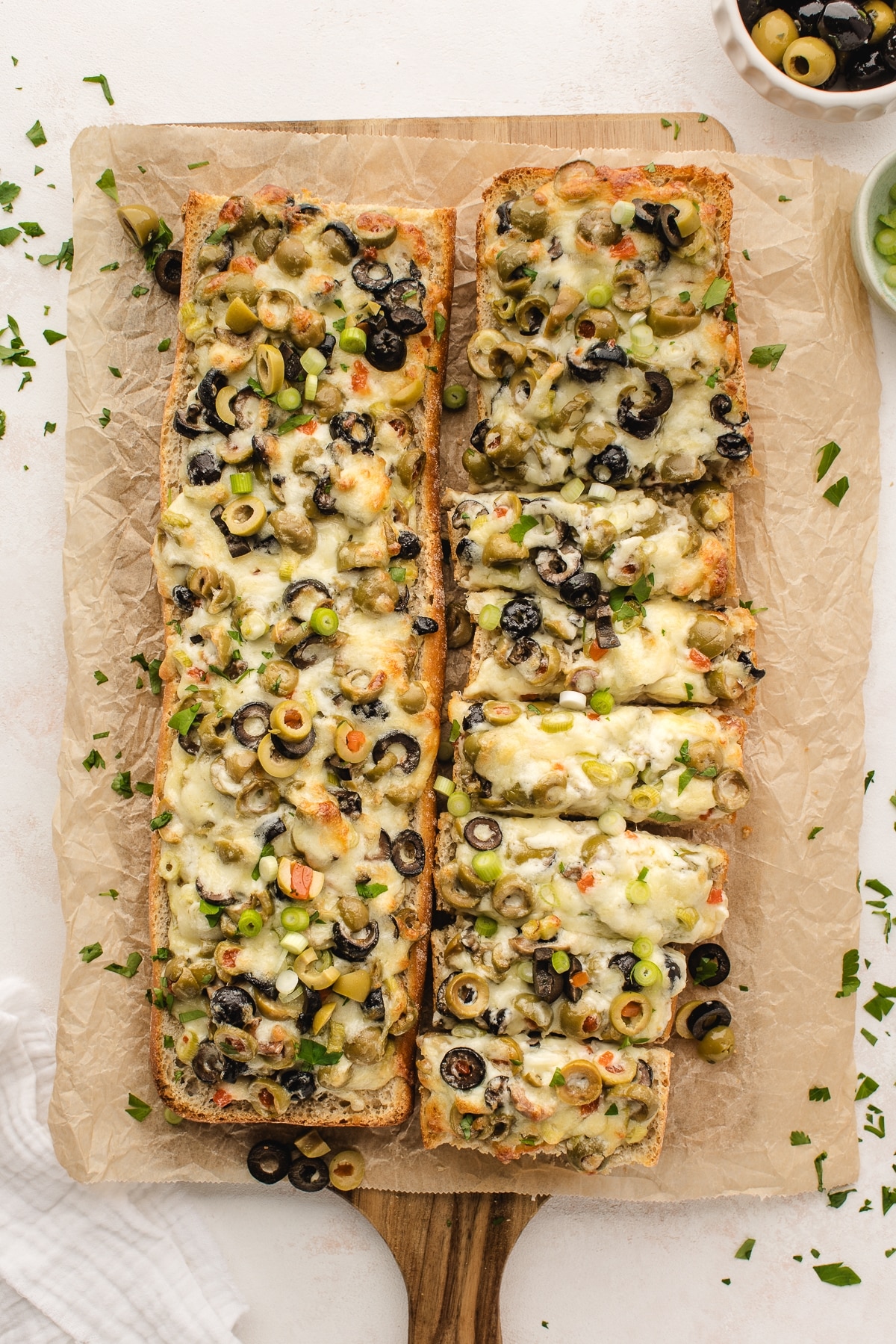 Indulge in this irresistible olive cheese bread recipe. Perfect as a party appetizer or a side dish for your favorite main course. French bread with olive and cheese spread