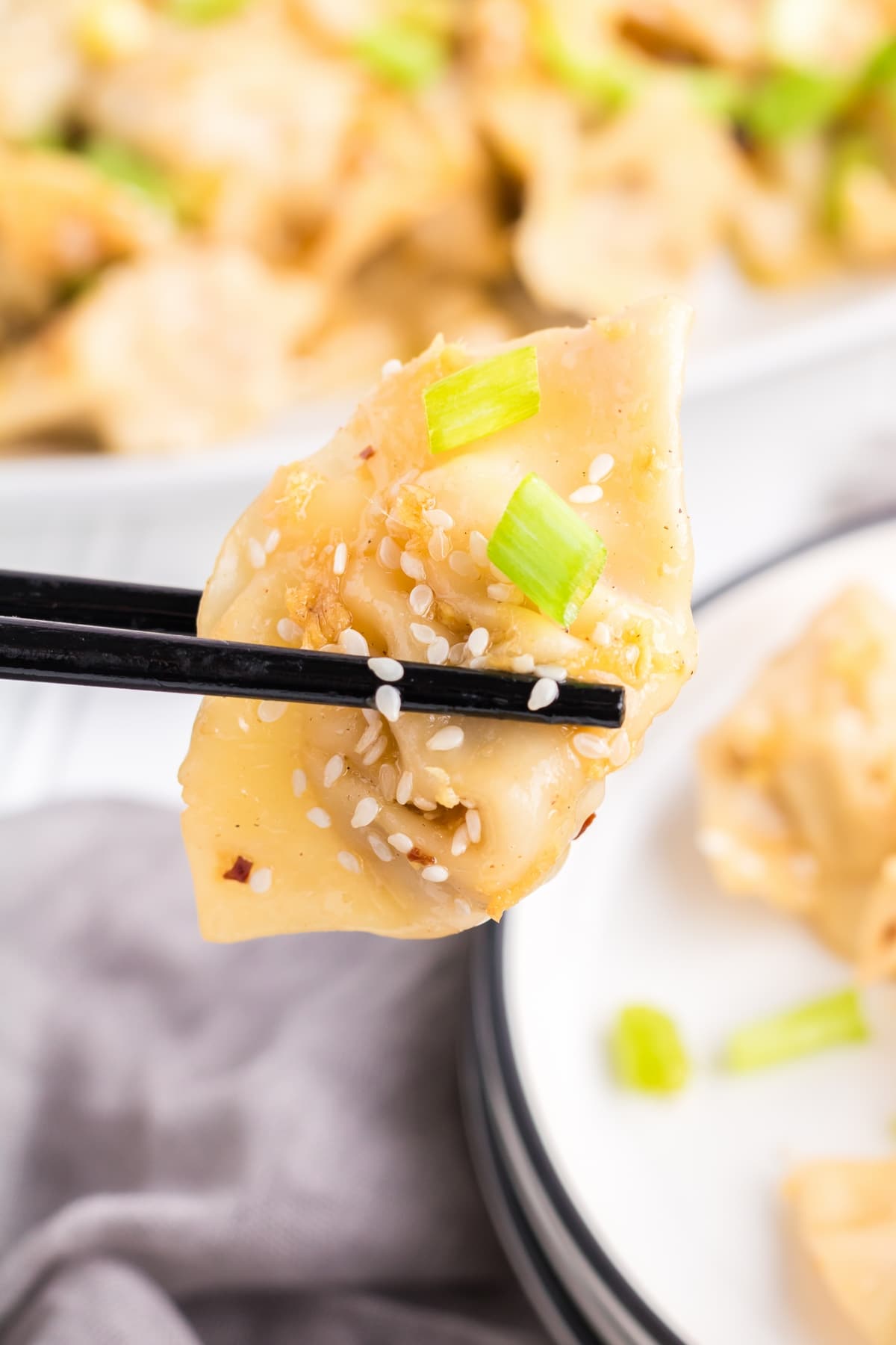 Spice up your meal with these mouthwatering spicy wontons! Made with fresh garlic, ginger, and a blend of seasonings, they're a crowd-pleaser. easy wonton recipe with frozen