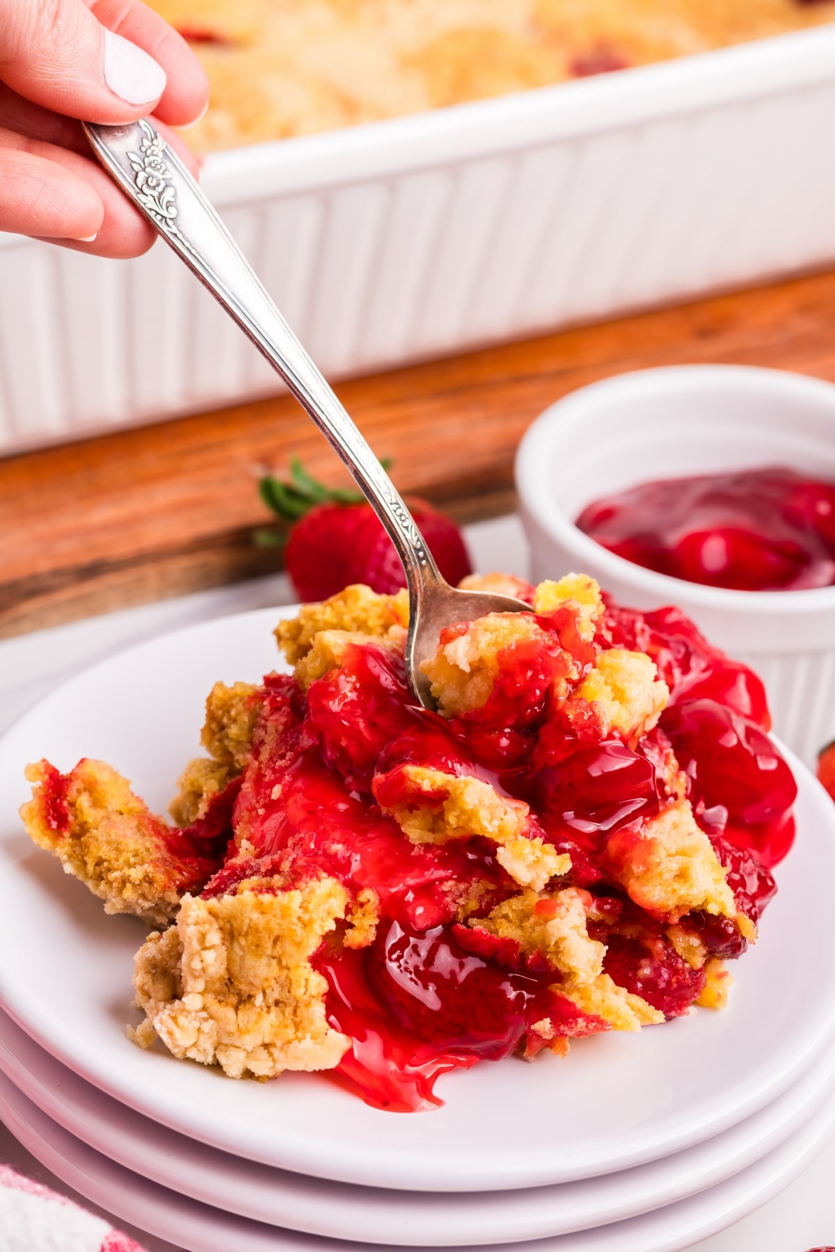 Make this quick and easy strawberry dump cake recipe. Top it off with creamy vanilla ice cream for an irresistible dessert. strawberry dump cakes