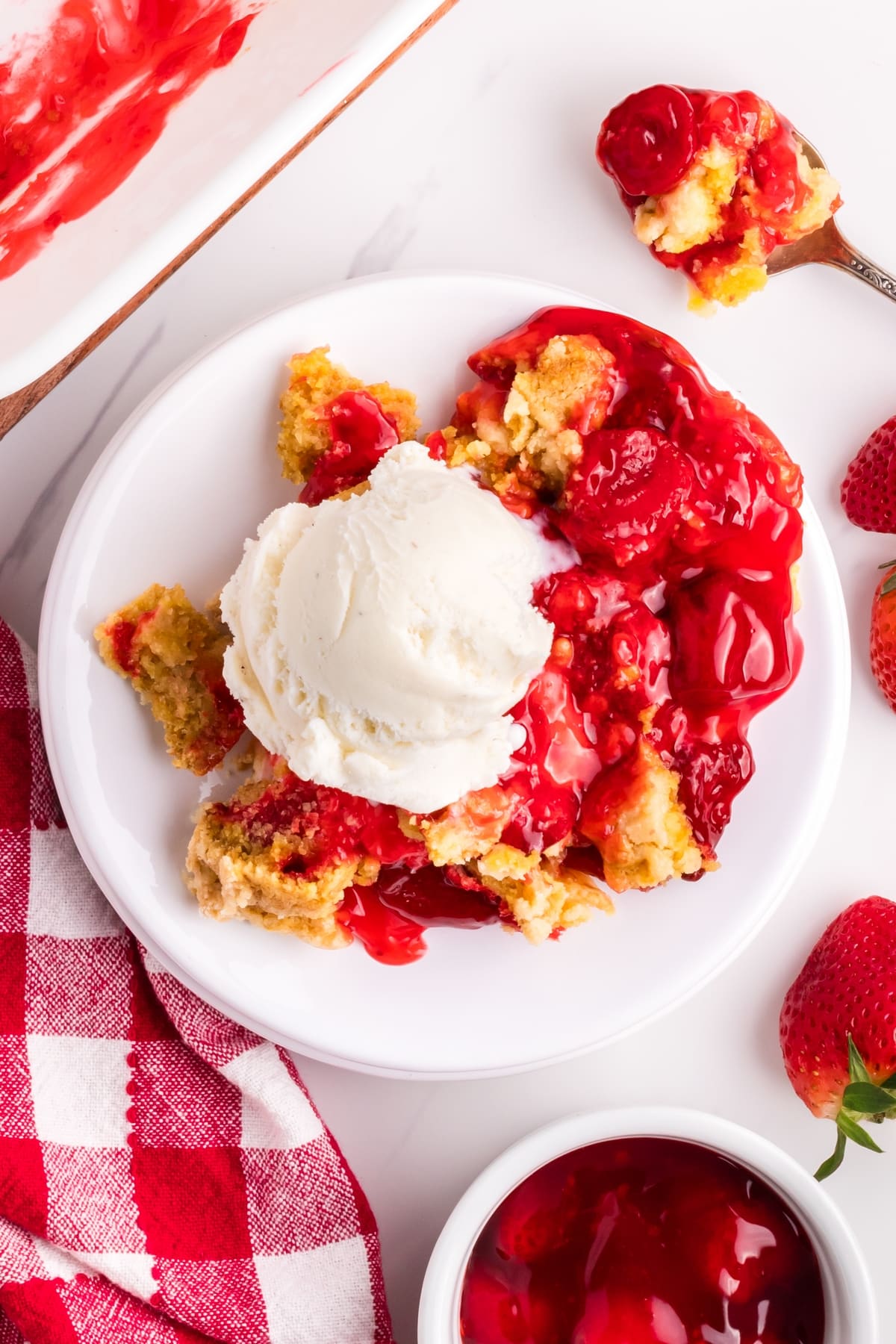 Make this quick and easy strawberry dump cake recipe. Top it off with creamy vanilla ice cream for an irresistible dessert. dump cake strawberry