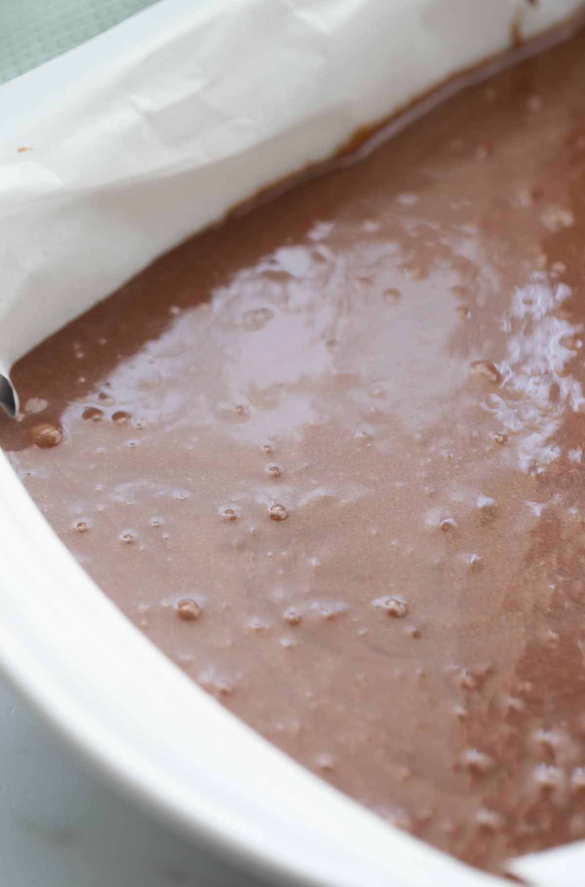 Brownie batter mixed with peppermint extract and bourbon 