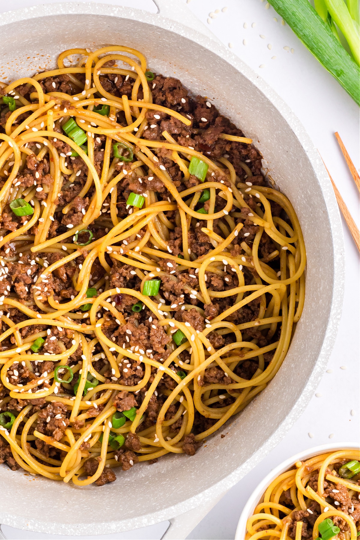 Takeout-style noodles in soy garlic Mongolian sauce tossed with ground beef, sesame seeds, and green onions.
