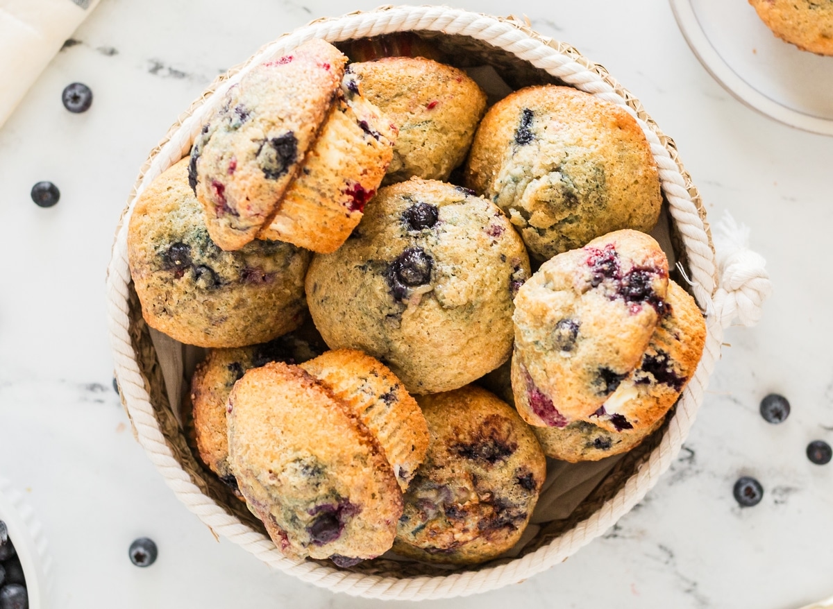 Tender berry muffins that aren't too sweet, with a light and airy texture and chunks of cream cheese baked into every bite. berry muffins with cream cheese