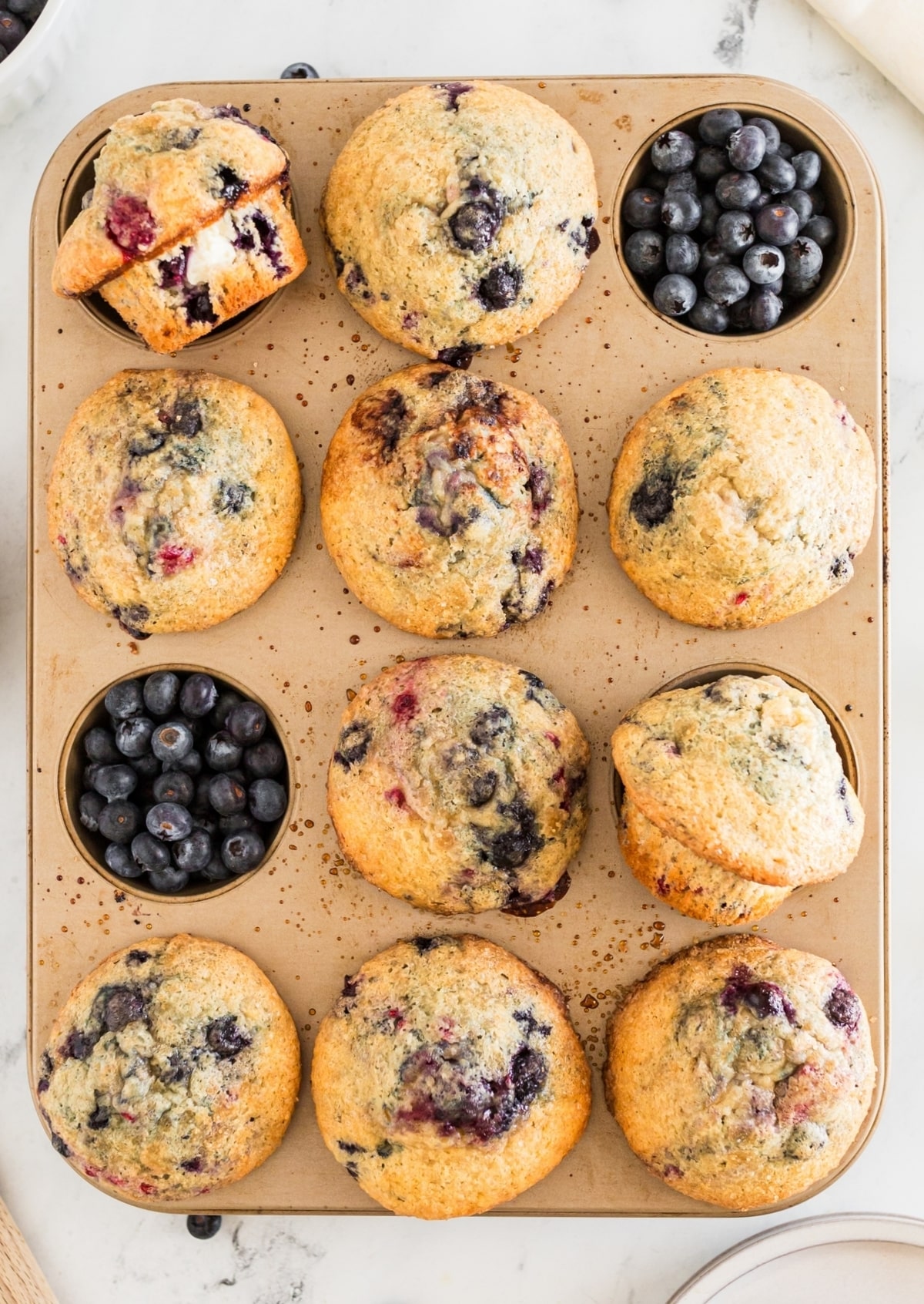 Tender berry muffins that aren't too sweet, with a light and airy texture and chunks of cream cheese baked into every bite. berry cream cheese muffins