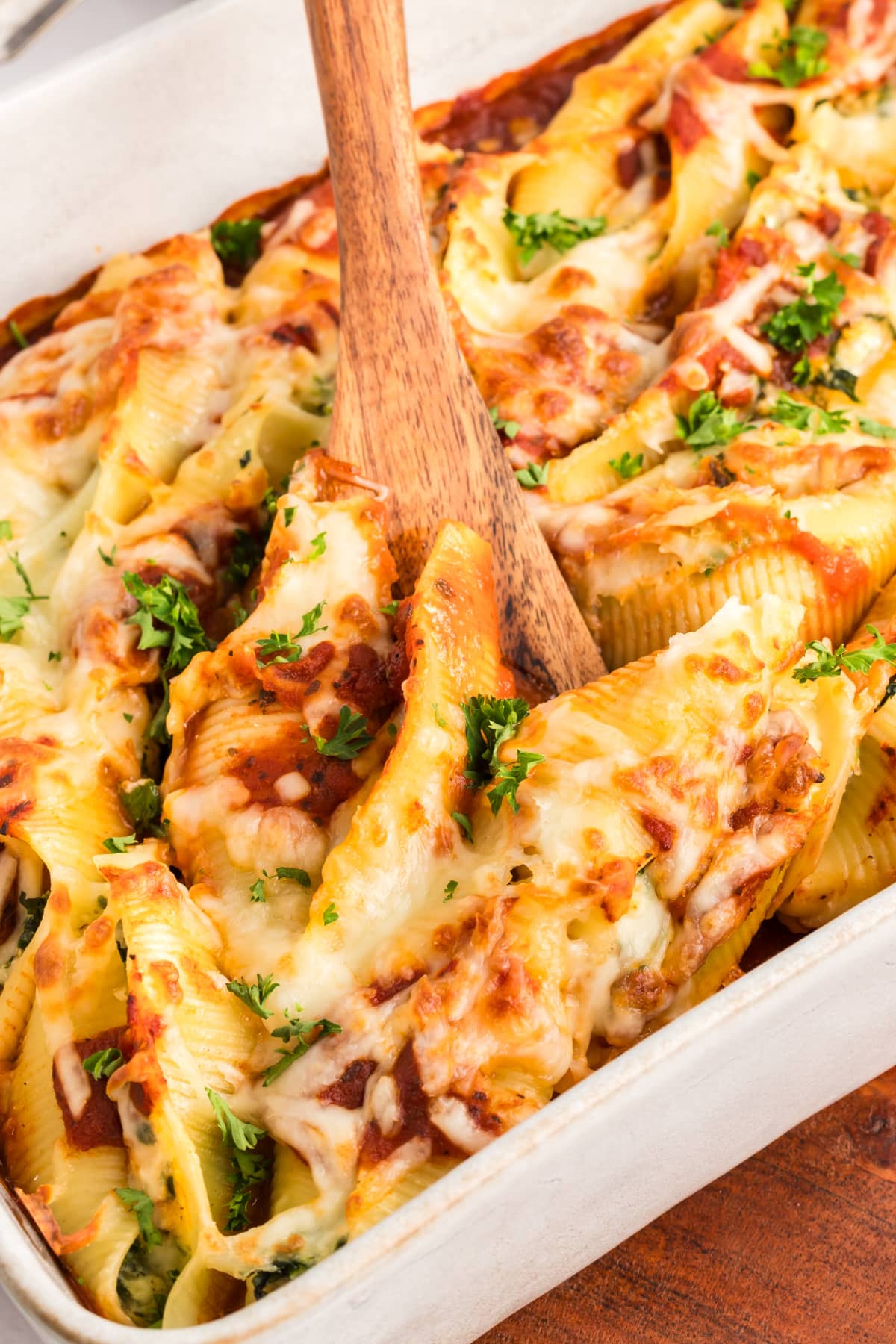 Stuffed shells with ricotta and spinach baked in marinara with browned mozzarella and parsley.