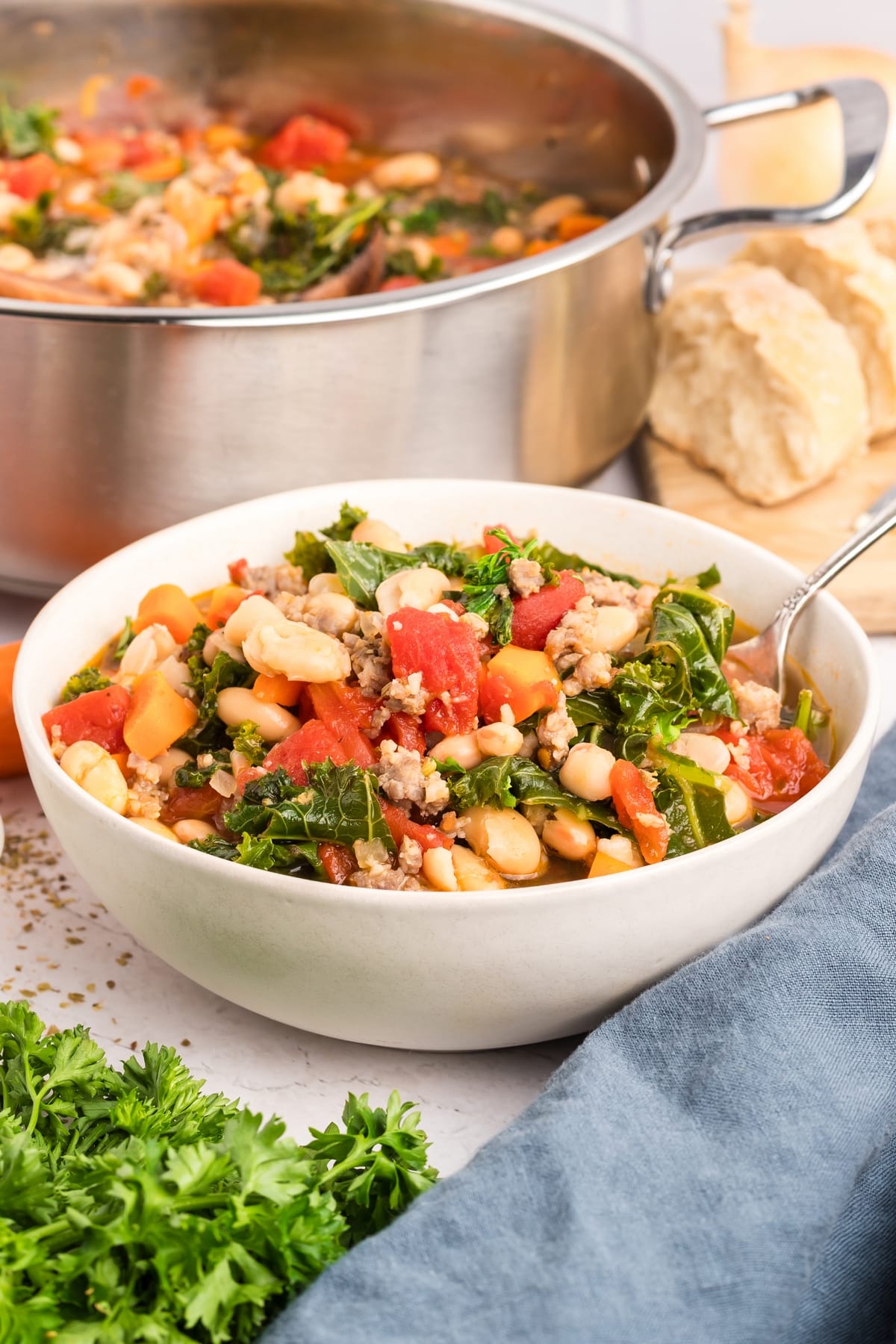 This kale and white bean sausage soup is one of my go-to comfort dinners. The combination of Italian sausage, garlic, and other seasonings makes this 30-minute soup taste like it’s been simmering on the stove all day. sausage soup with kale and white beans