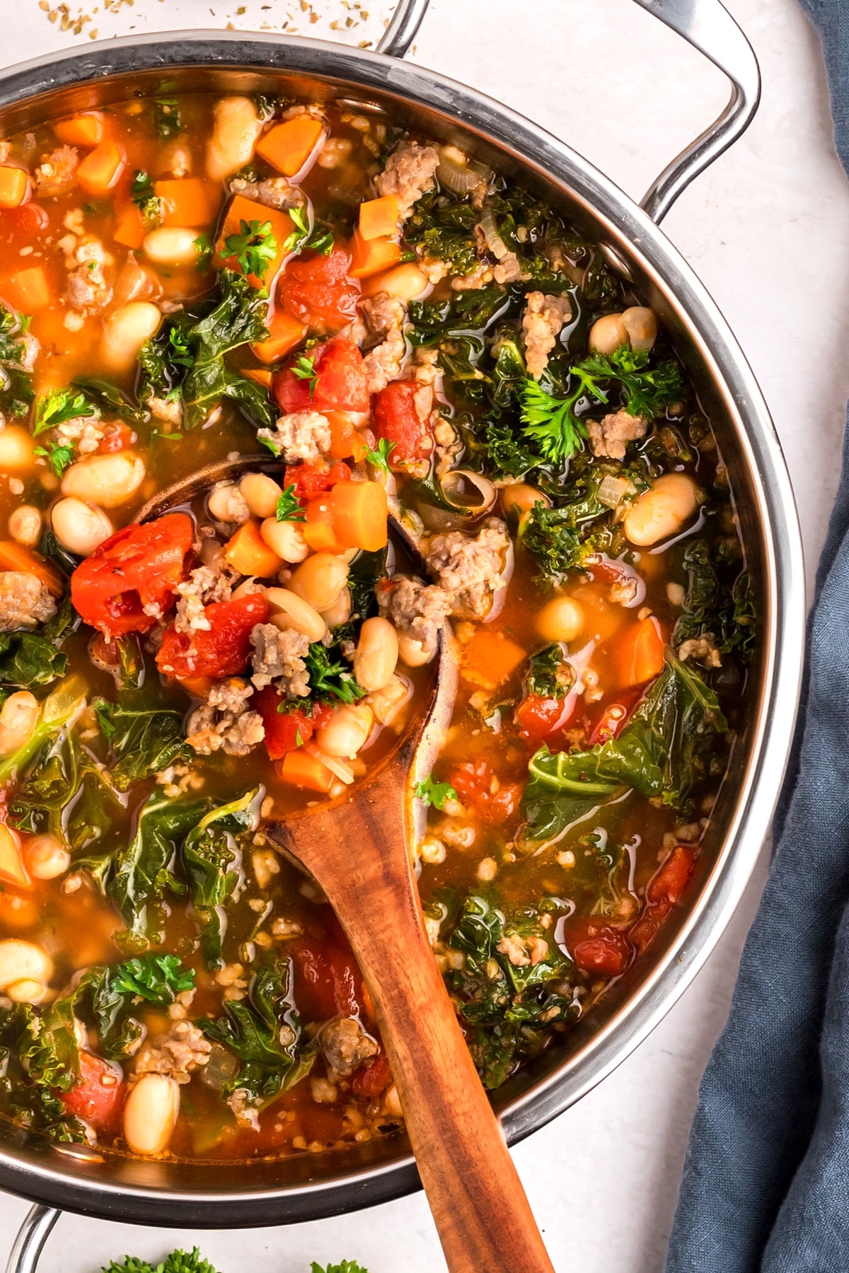 This kale and white bean sausage soup is one of my go-to comfort dinners. The combination of Italian sausage, garlic, and other seasonings makes this 30-minute soup taste like it’s been simmering on the stove all day. kale and white bean sausage soup