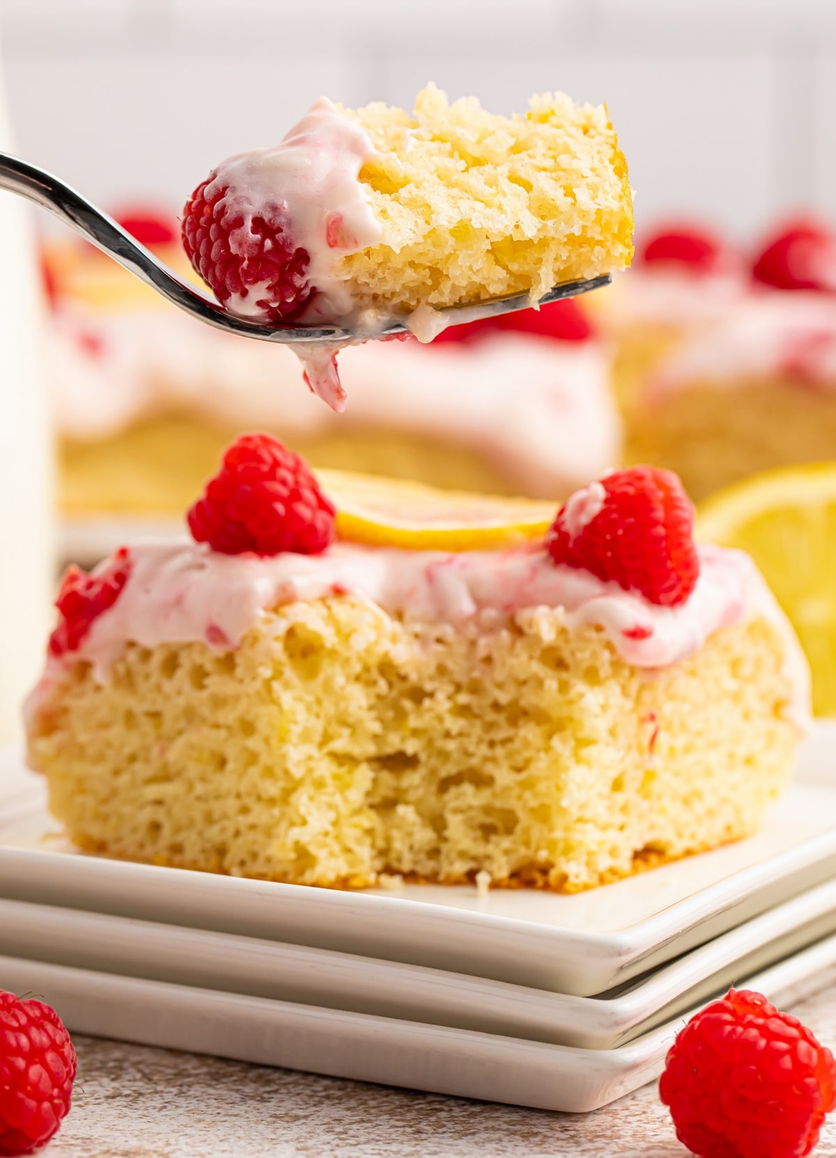 A buttermilk lemon raspberry frosted sheet cake made with —sun-ripened raspberries and tart lemon. It's one deliciously tender cake! lemon raspberry frosted sheet cake