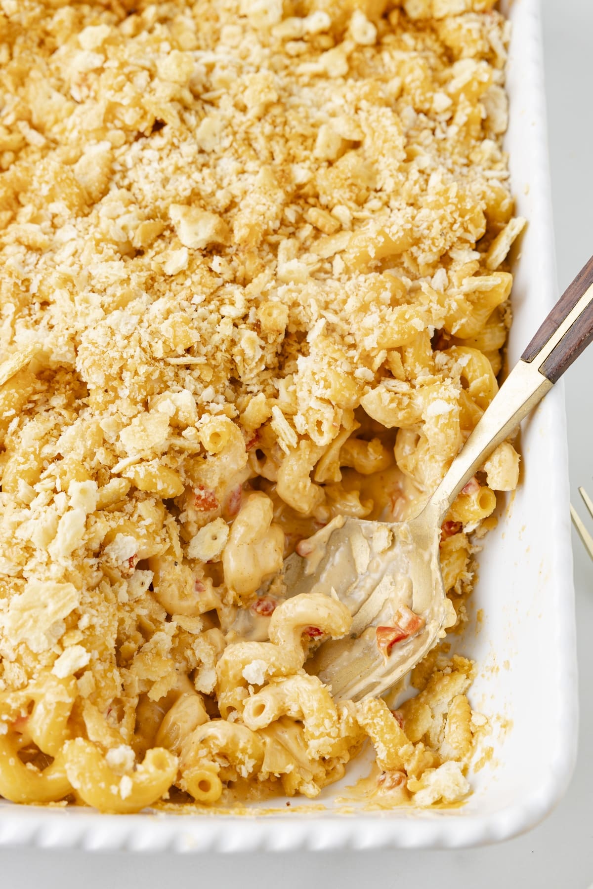If you love pimento cheese in any form, you'll go crazy for it with macaroni. My pimento macaroni and cheese blends two Southern classics into one mouthwatering dish. The creamy cheese sauce, pimento peppers and crushed Ritz cracker topping make this a favorite side dish. pimento macaroni and cheese