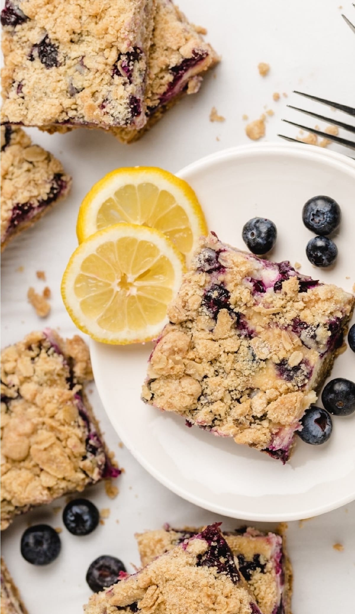Overhead shot of lemon blueberry bars arranged on a plate