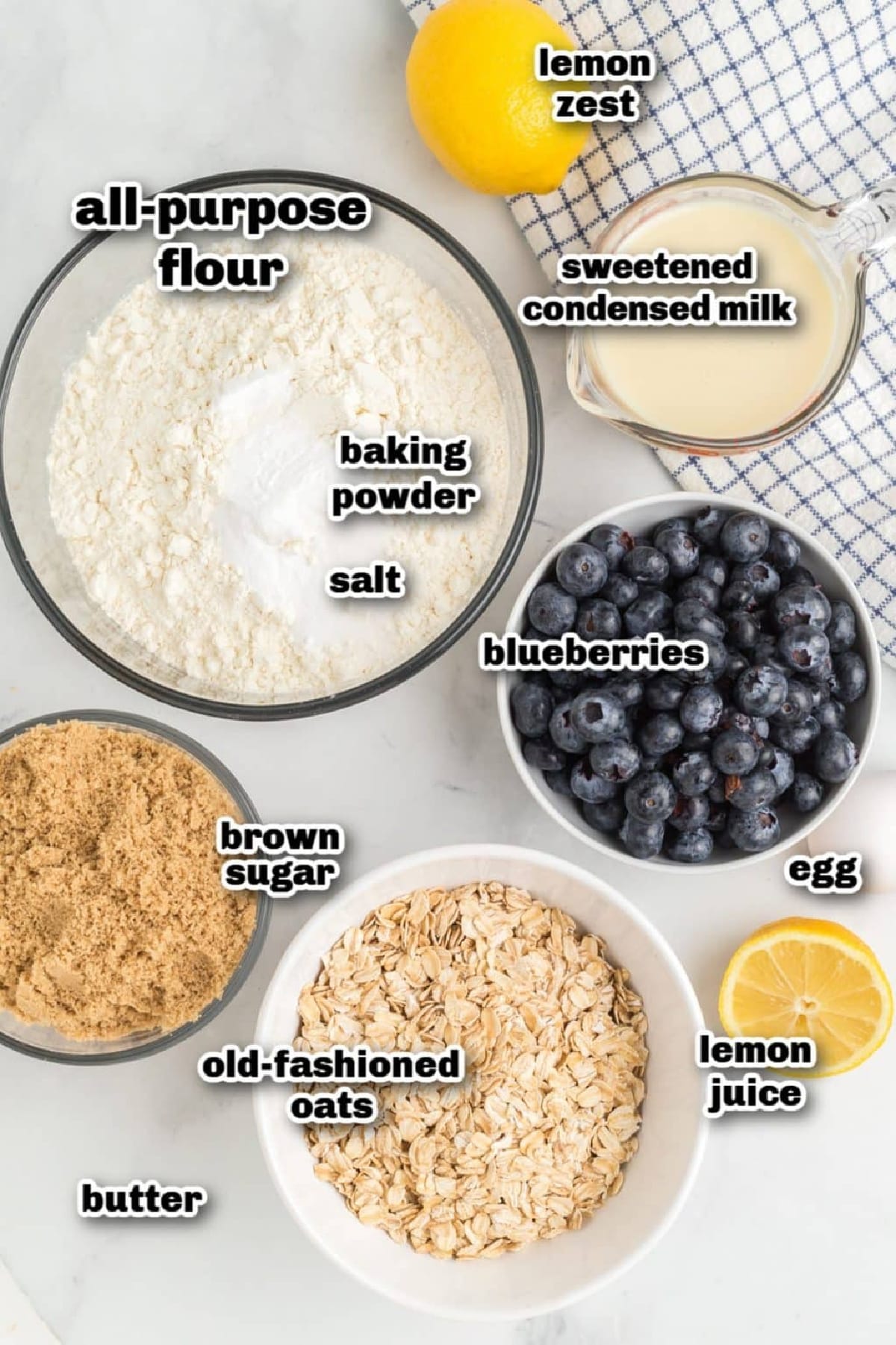 Measured ingredients for lemon blueberry crumble bars arranged on a counter