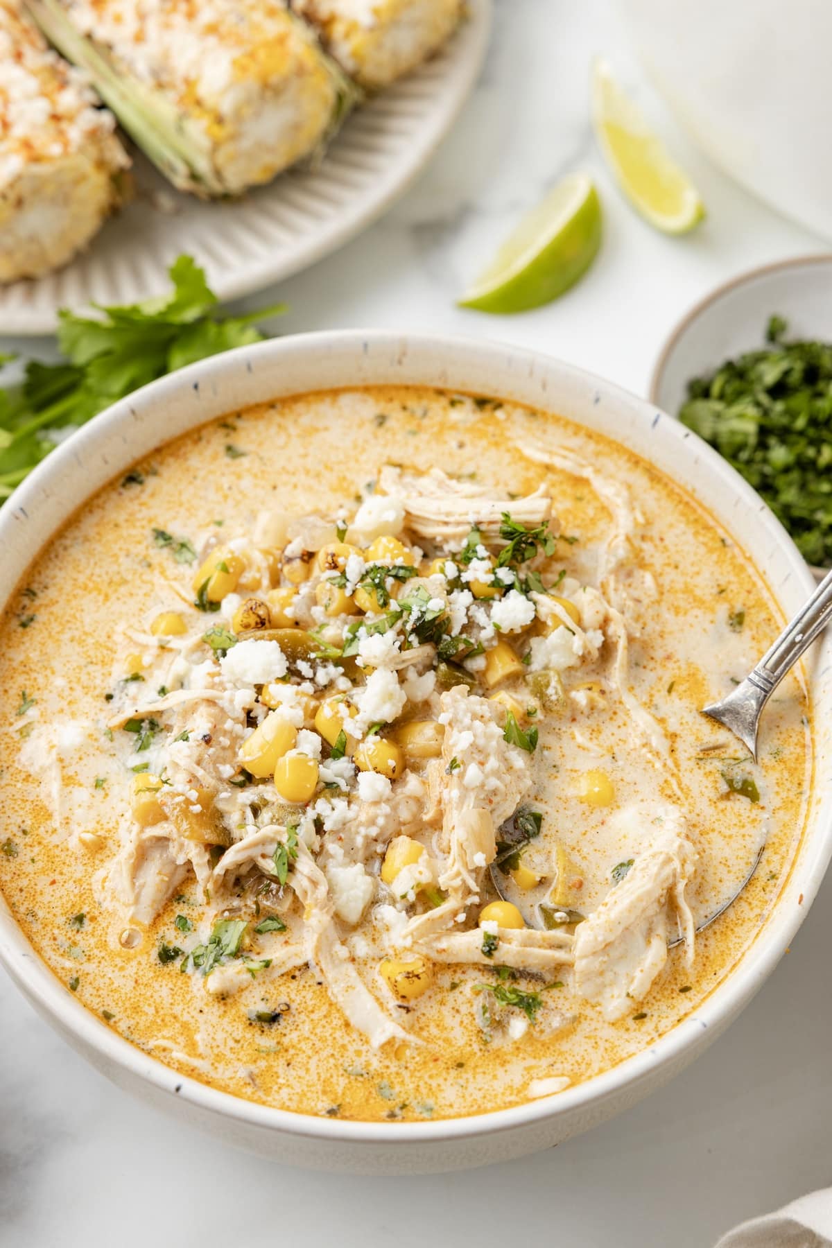 This Mexican Street Corn Soup is inspired by elote, bringing all those bold, zesty flavors into a cozy, comforting bowl. It's like eating favorite street food with a spoon. street corn soup with chicken