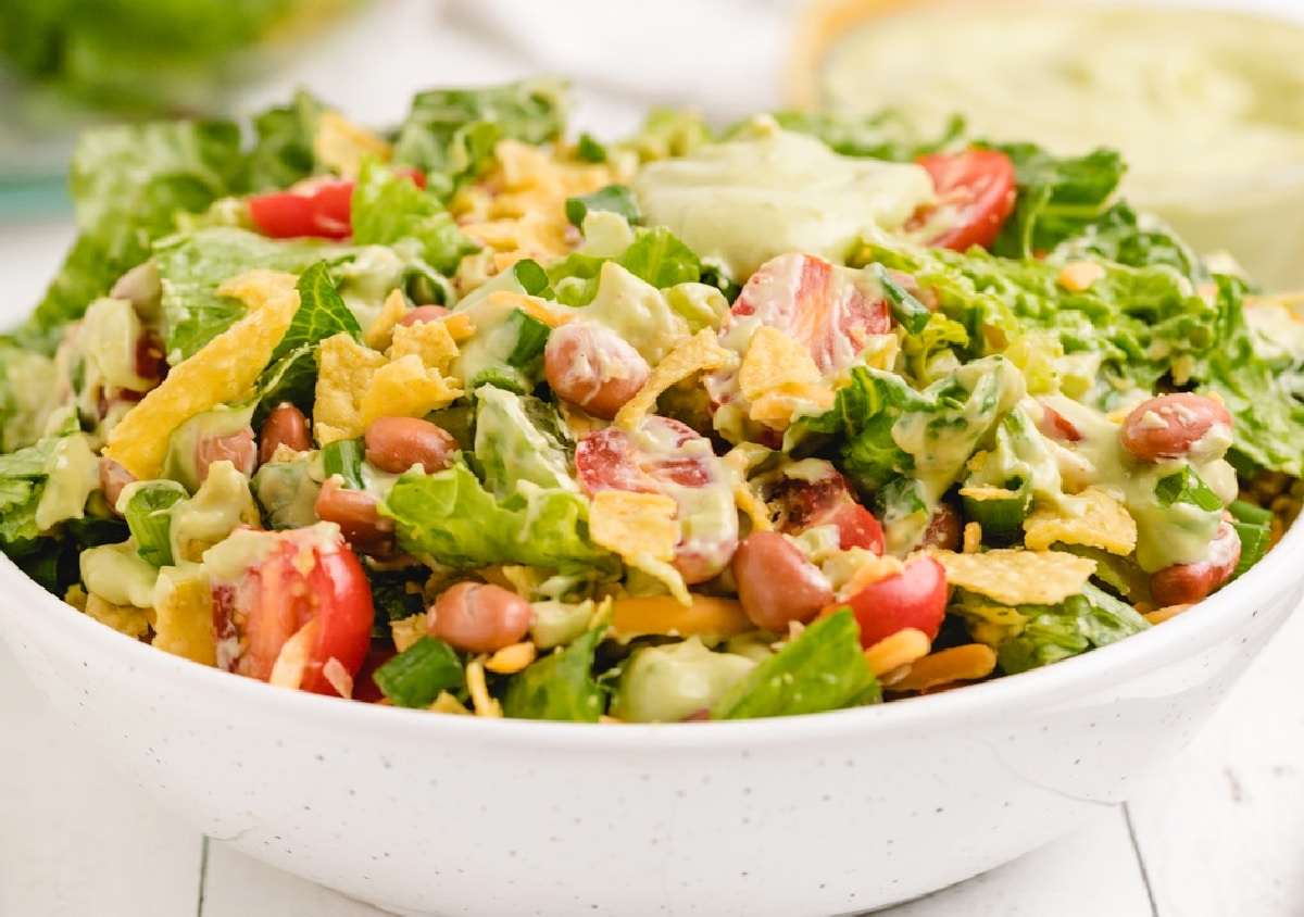 Thick and creamy avocado salad dressing shown in a bowl Close-up of thick avocado salad dressing in a bowl with Mexican Salad
