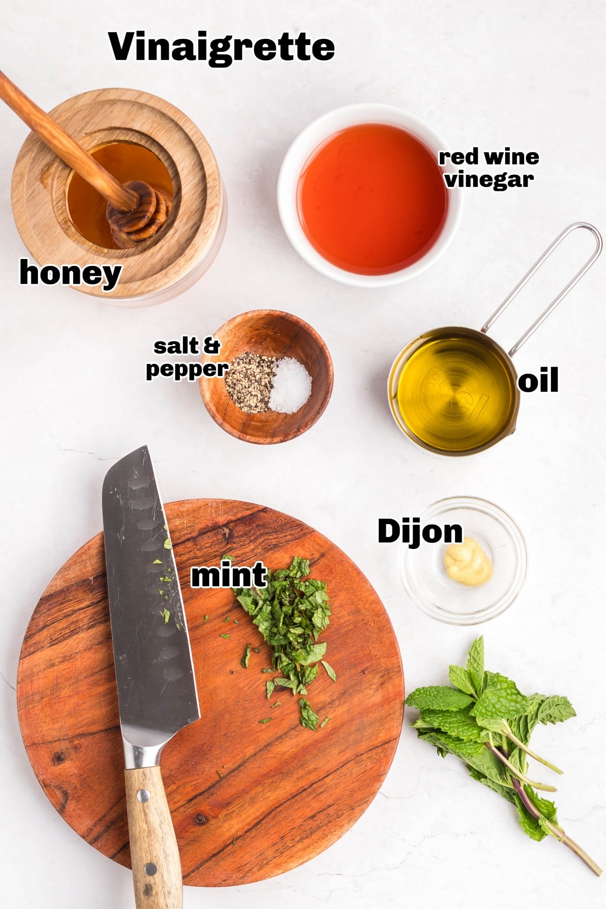 Honey-mint vinaigrette ingredients Ingredients for honey-mint vinaigrette including avocado oil, red wine vinegar, honey, chopped mint, Dijon mustard, salt, and pepper.