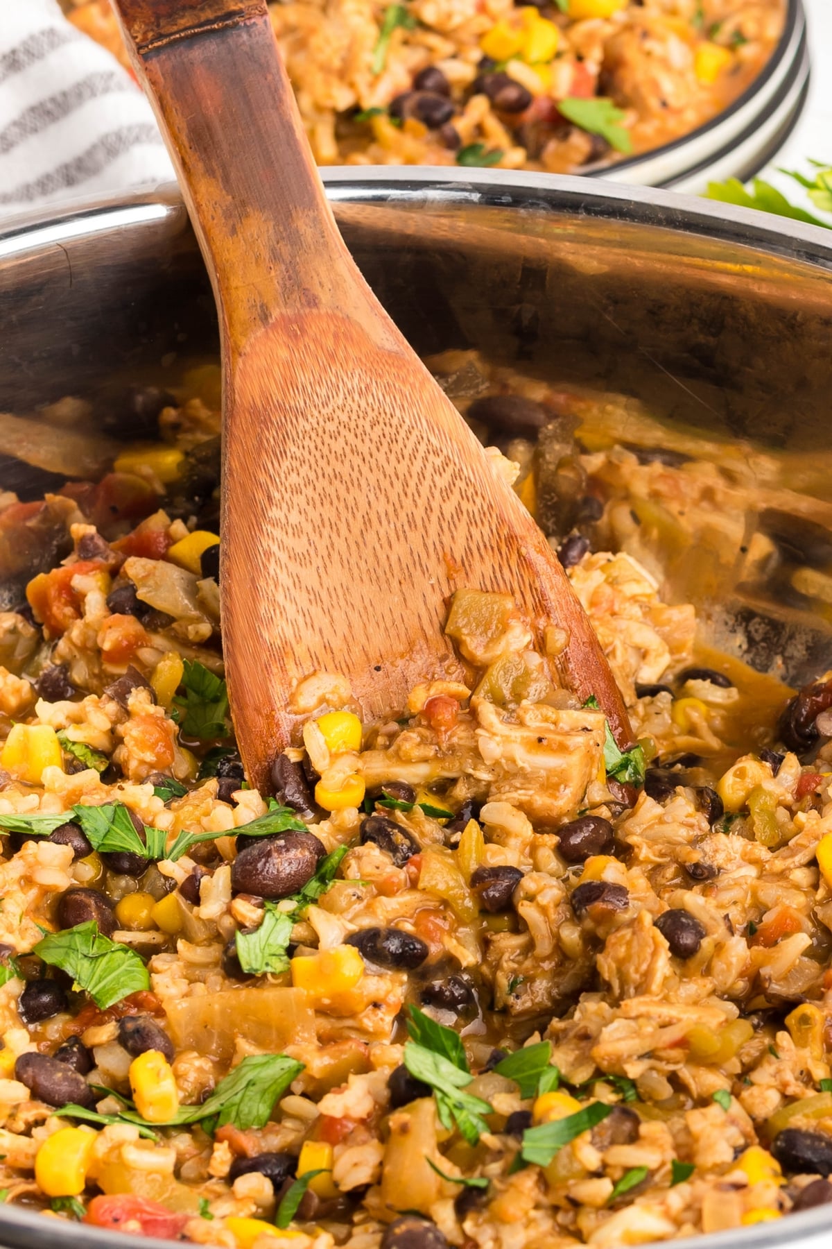 close up of the turkey skillet with a wooden spoon