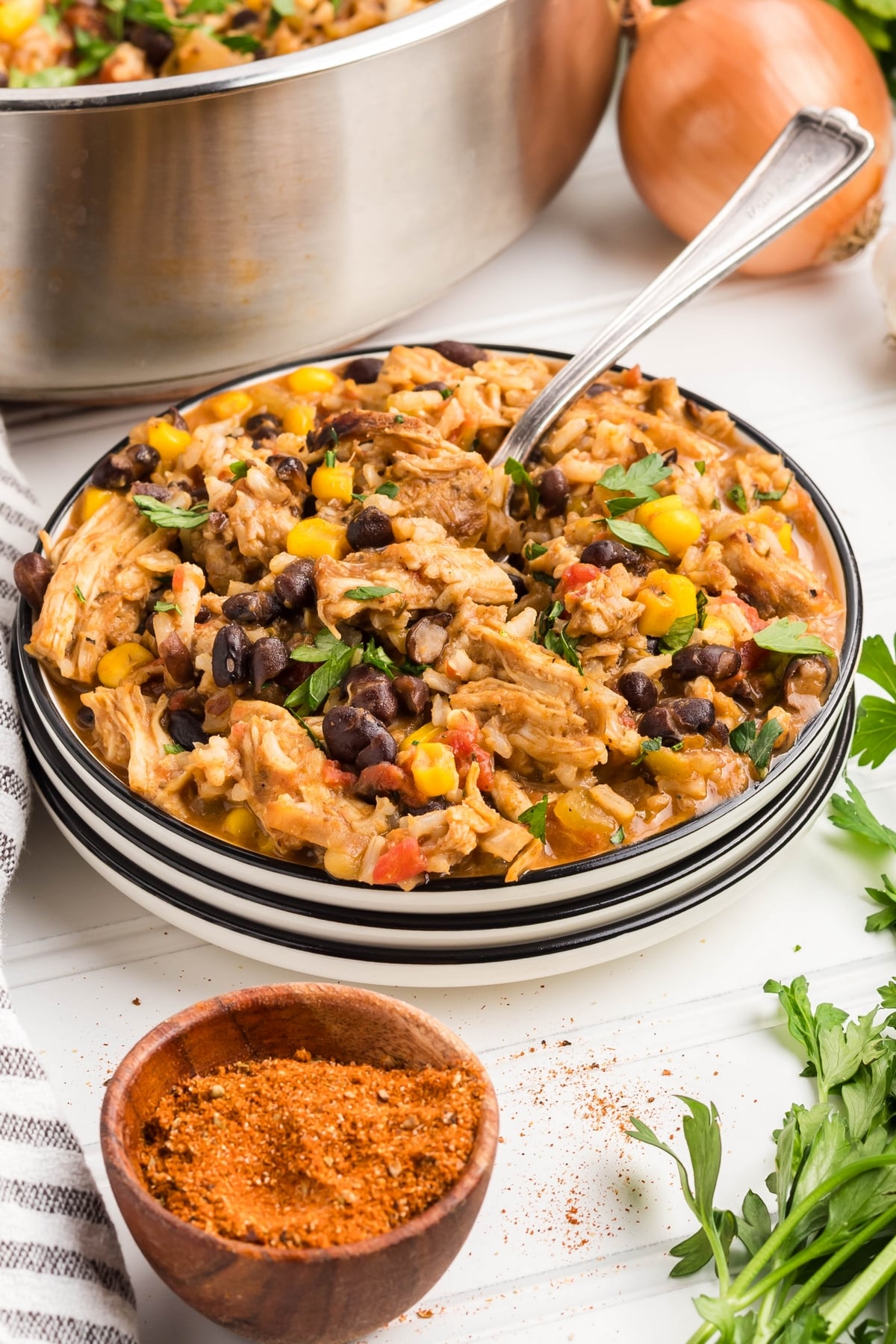 turkey skillet recipe on a stack of white plates.