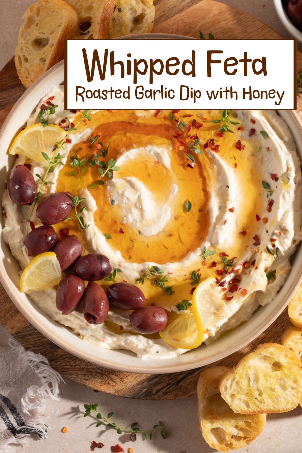 This whipped feta roasted garlic dip with honey is creamy, rich, and bursting with flavor. The roasted garlic and lemon tie everything together perfectly. via @cmpollak1