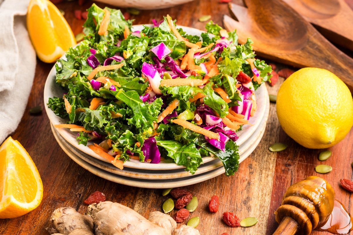 kale salad on a stack of plates