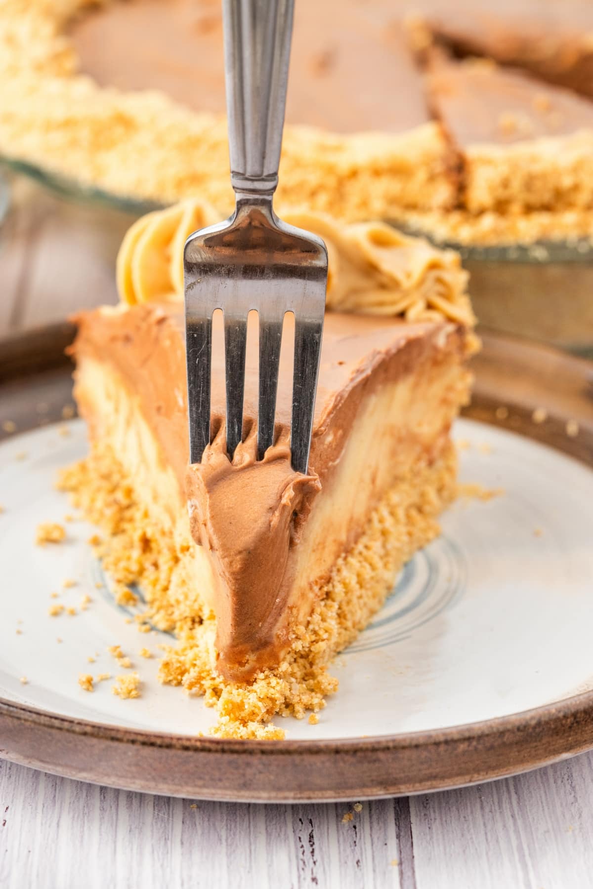 taking a bite of peanut butter cream pie