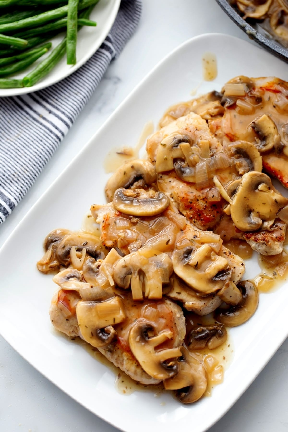 Pork Marsala served with boneless pork chops and mushroom Marsala sauce.