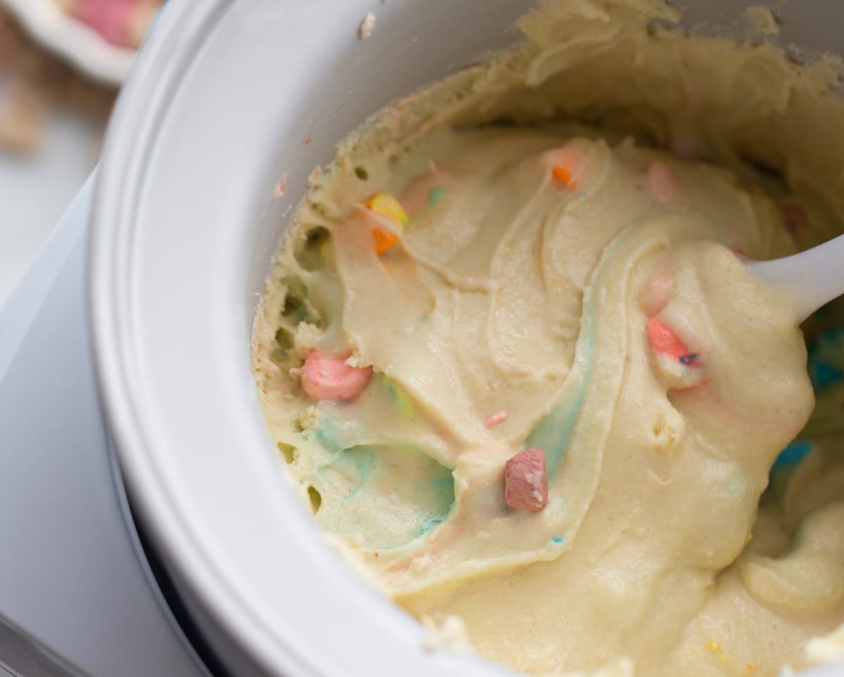 Cereal ice cream in the ice cream maker from overhead lucy charms ice cream being made in the ice cream maker