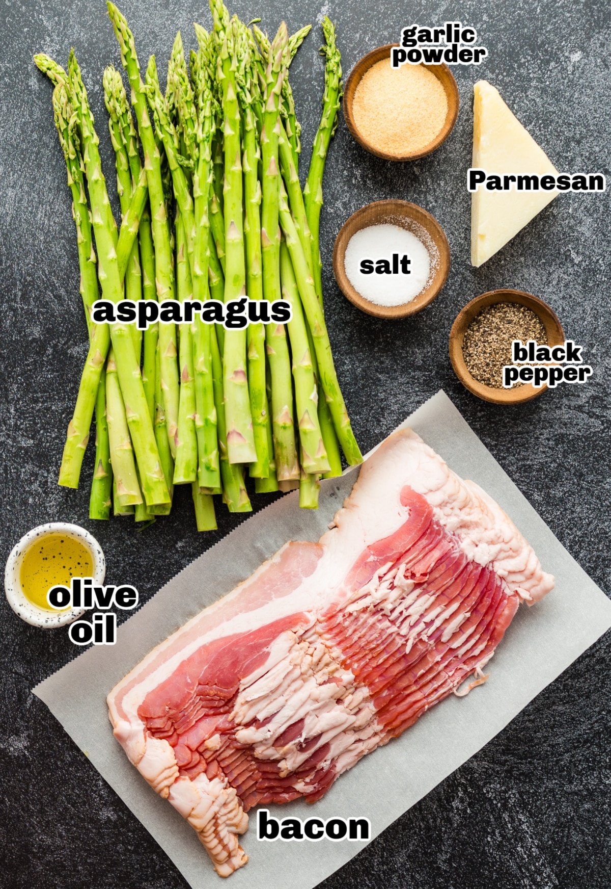 Ingredients for bacon-wrapped asparagus arranged on a countertop