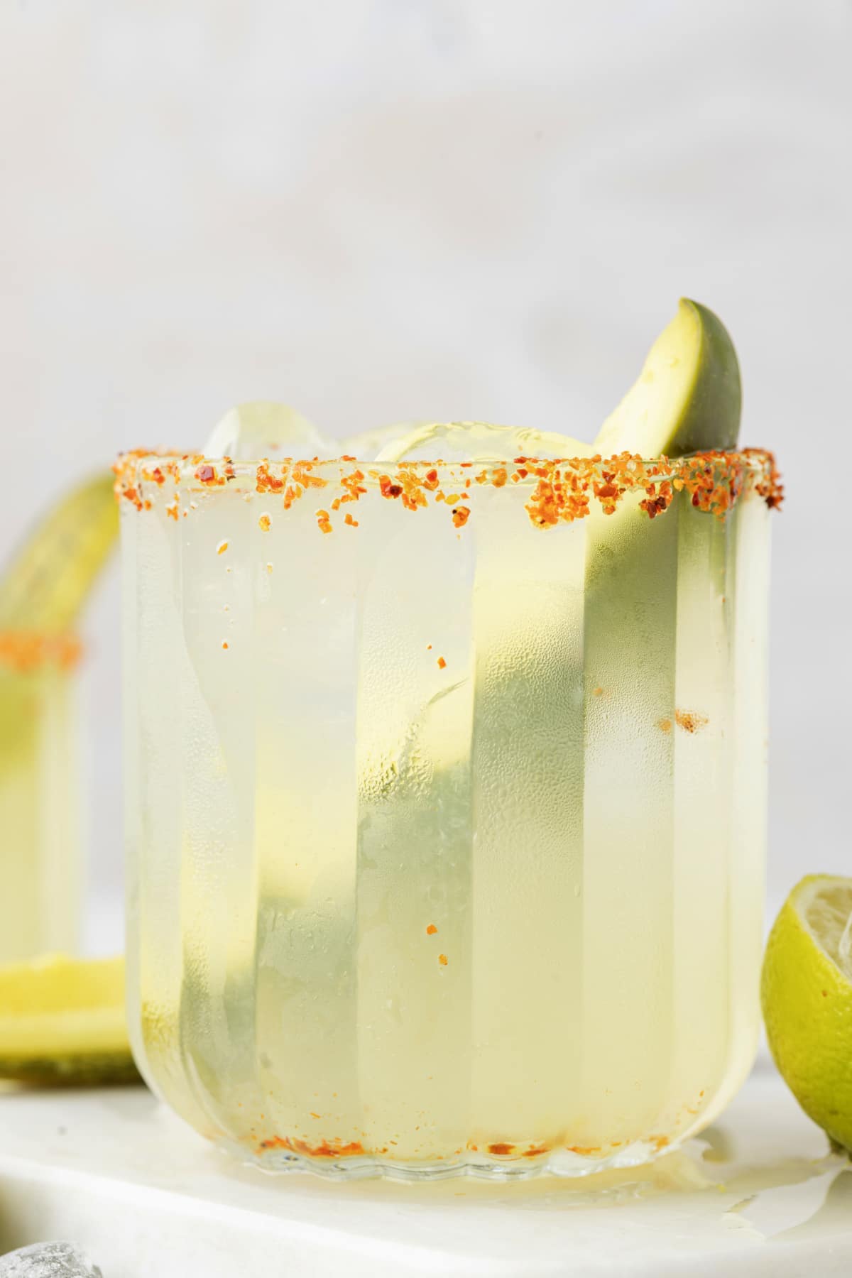 Pickle Margarita on Marble Table Side view of a dill pickle margarita on a marble surface