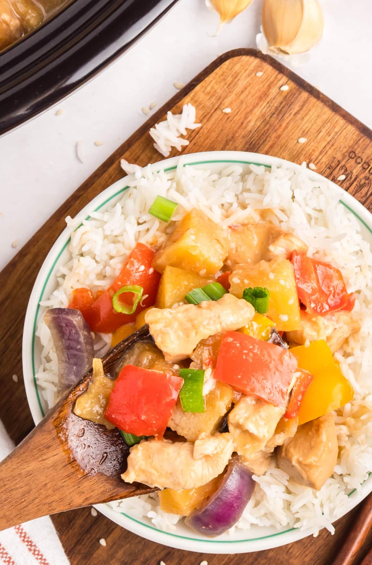Close view – Crockpot Hawaiian Chicken, garlic & pineapple Close-up of tender pineapple chicken pieces coated in hoisin garlic sauce