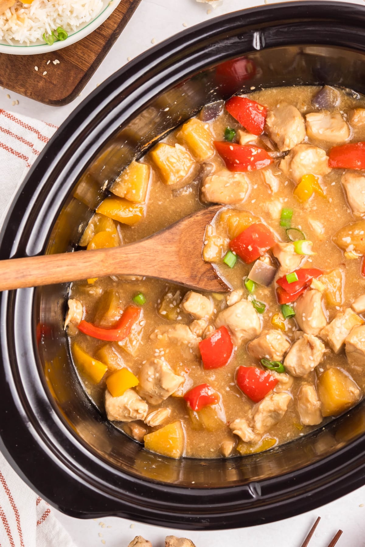 Slow Cooker Hawaiian Chicken – sweet pineapple hoisin sauce Overhead shot of sweet and saucy slow cooker Hawaiian pineapple chicken in crockpot