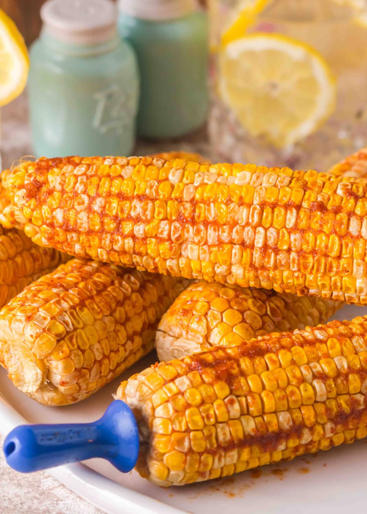 Finished pellet grill corn on the cob ready to serve Smoked corn on the cob with garlic butter served hot off the pellet grill