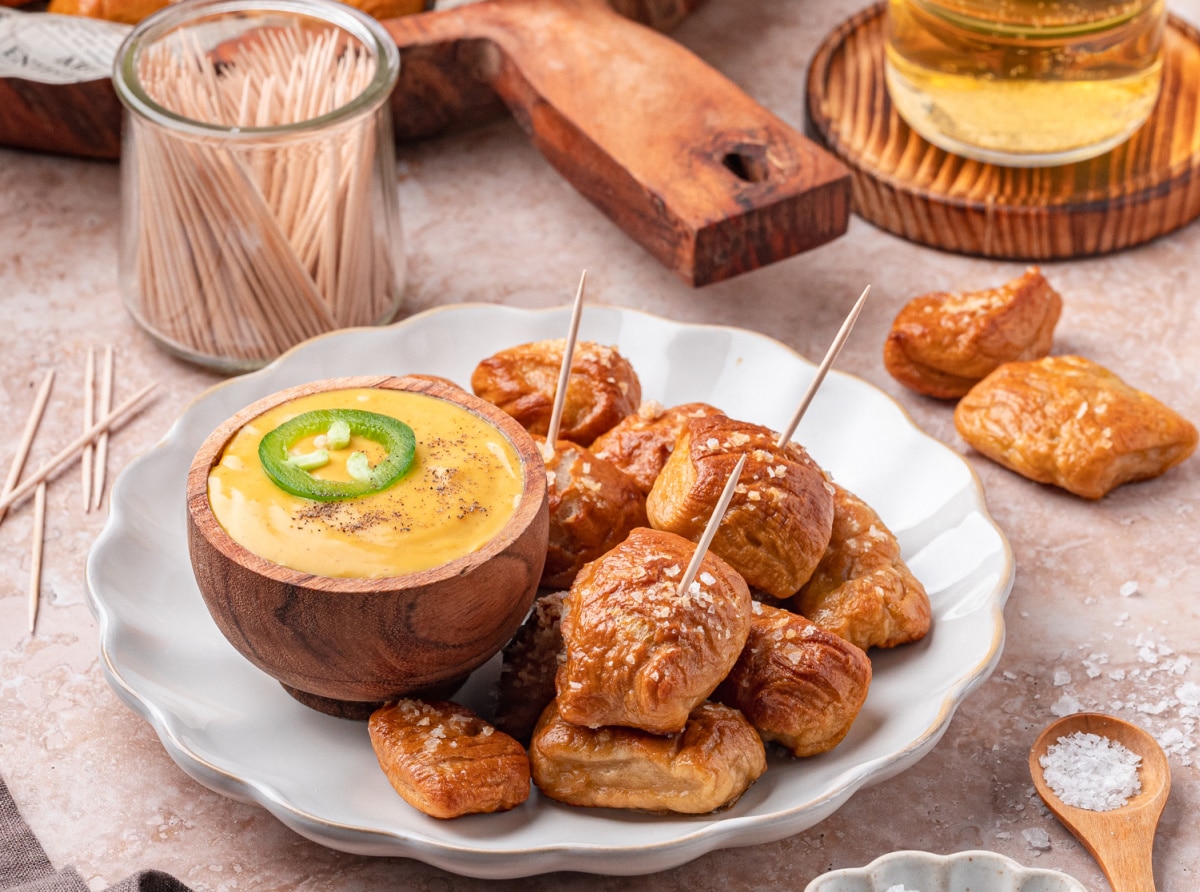 Chewy, golden pretzel bites plated and ready to eat soft pretzel bites stacked on a plate ready to serve with dipping sauces