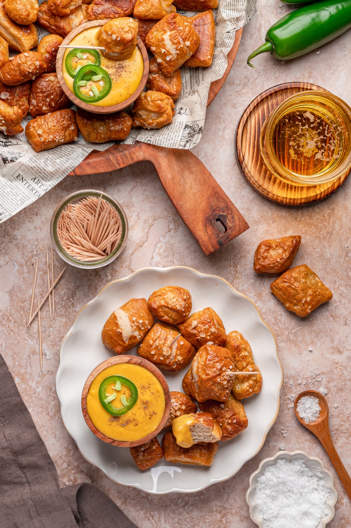 Party ready homemade pretzel bites with nacho cheese dipping sauce overhead of a full spread of homemade pretzel bites ready to serve