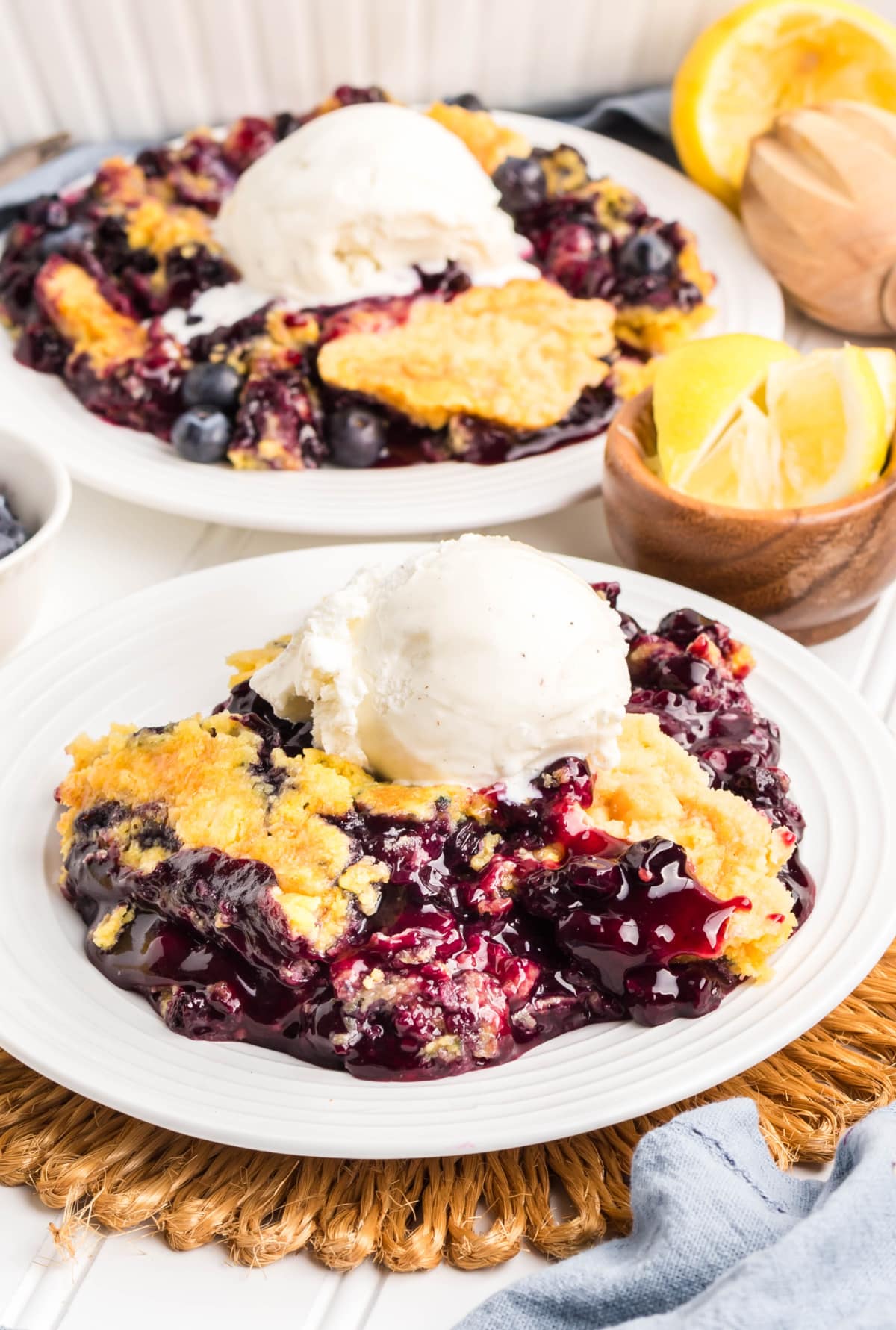 Close-up of golden buttery crust with blueberry filling peeking through.