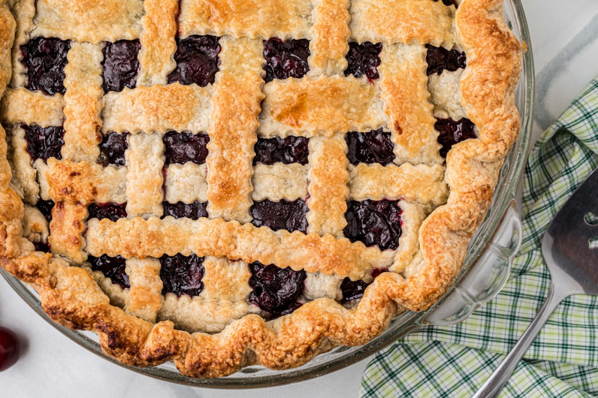 Fresh Cherry Pie with a golden lattice crust baked until crisp and lightly browned