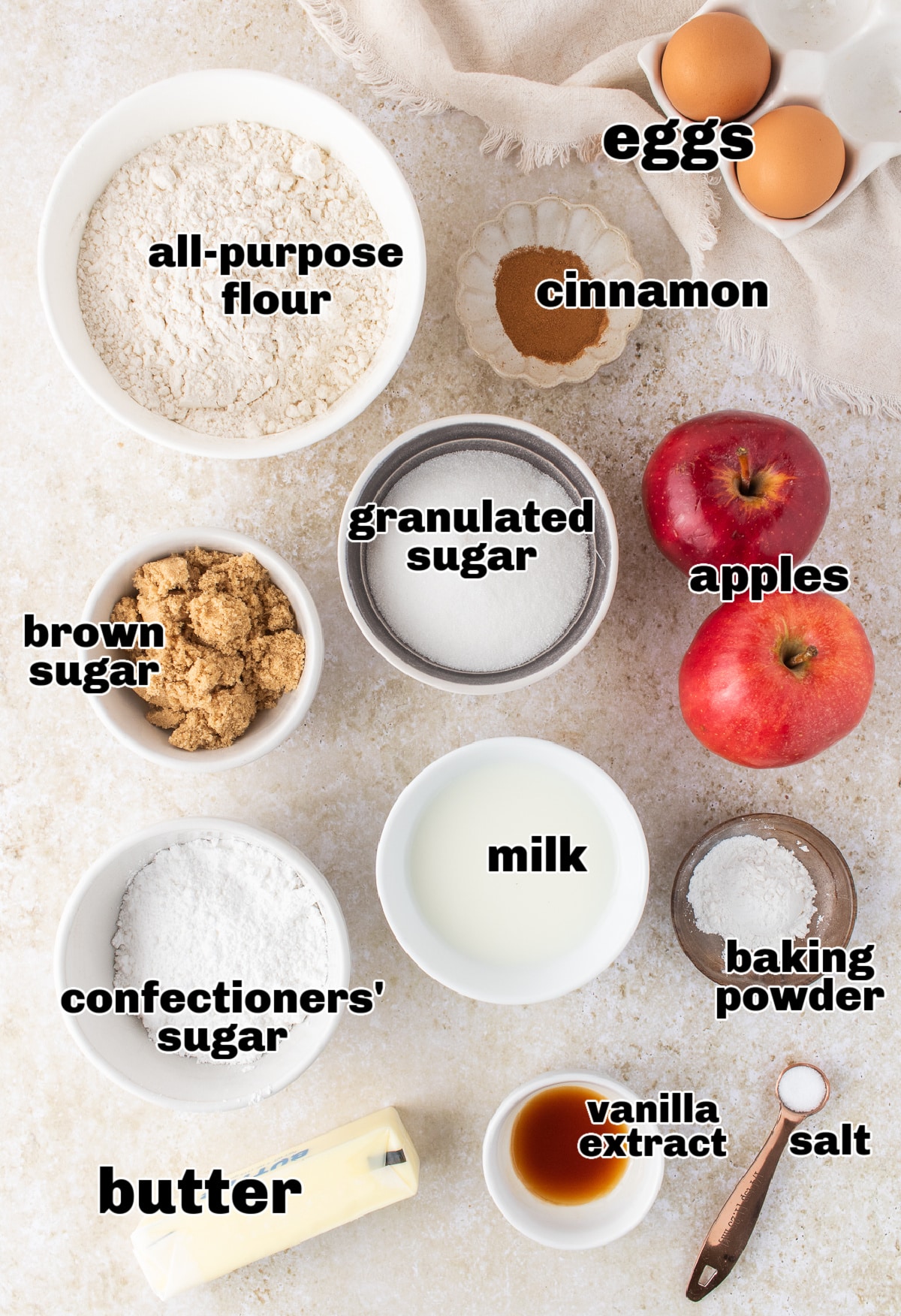 Baking ingredients for Amish apple fritter bread including flour, apples, sugars, and cinnamon.