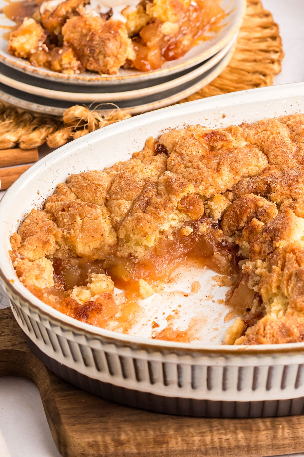 Close up of apple cobbler with cinnamon sugar crust baked golden brown.