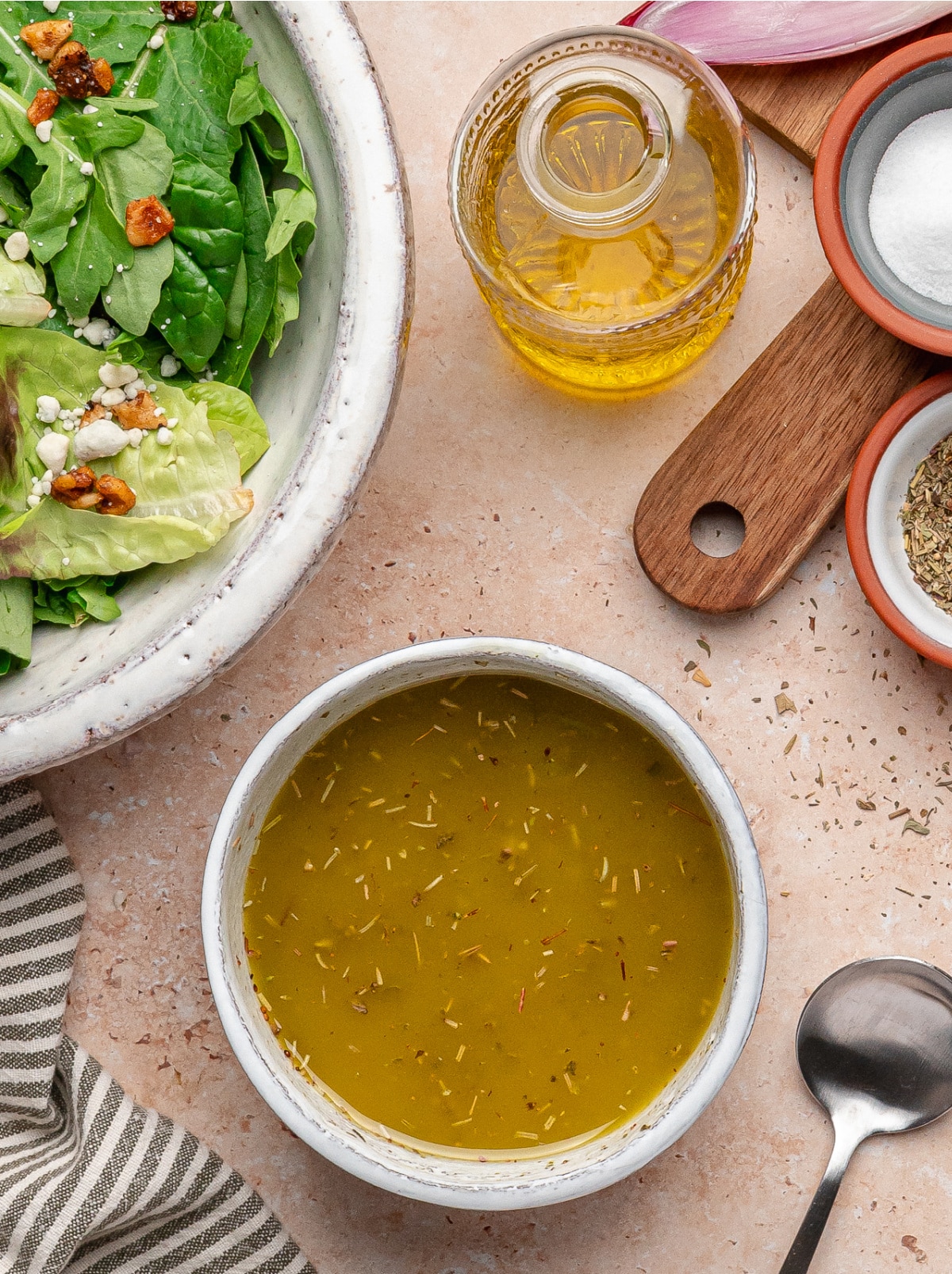 Homemade White Balsamic Vinaigrette Bowl of homemade white balsamic vinaigrette with olive oil and herbs