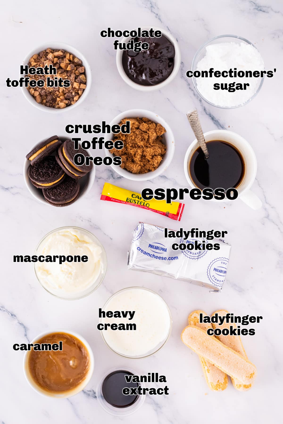 Ingredients for toffee tiramisu including espresso, mascarpone, caramel, heavy cream, cream cheese, ladyfingers, confectioners’ sugar, and crushed Toffee Crunch OREOs.