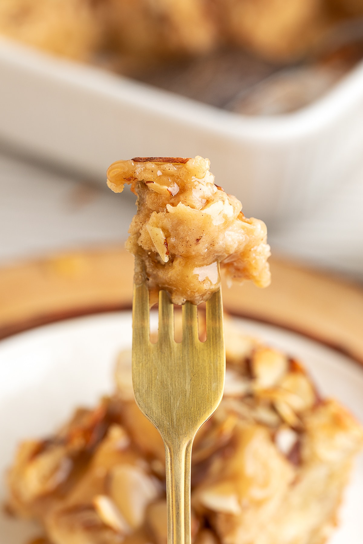 a forkful of almond bread pudding with marzipan