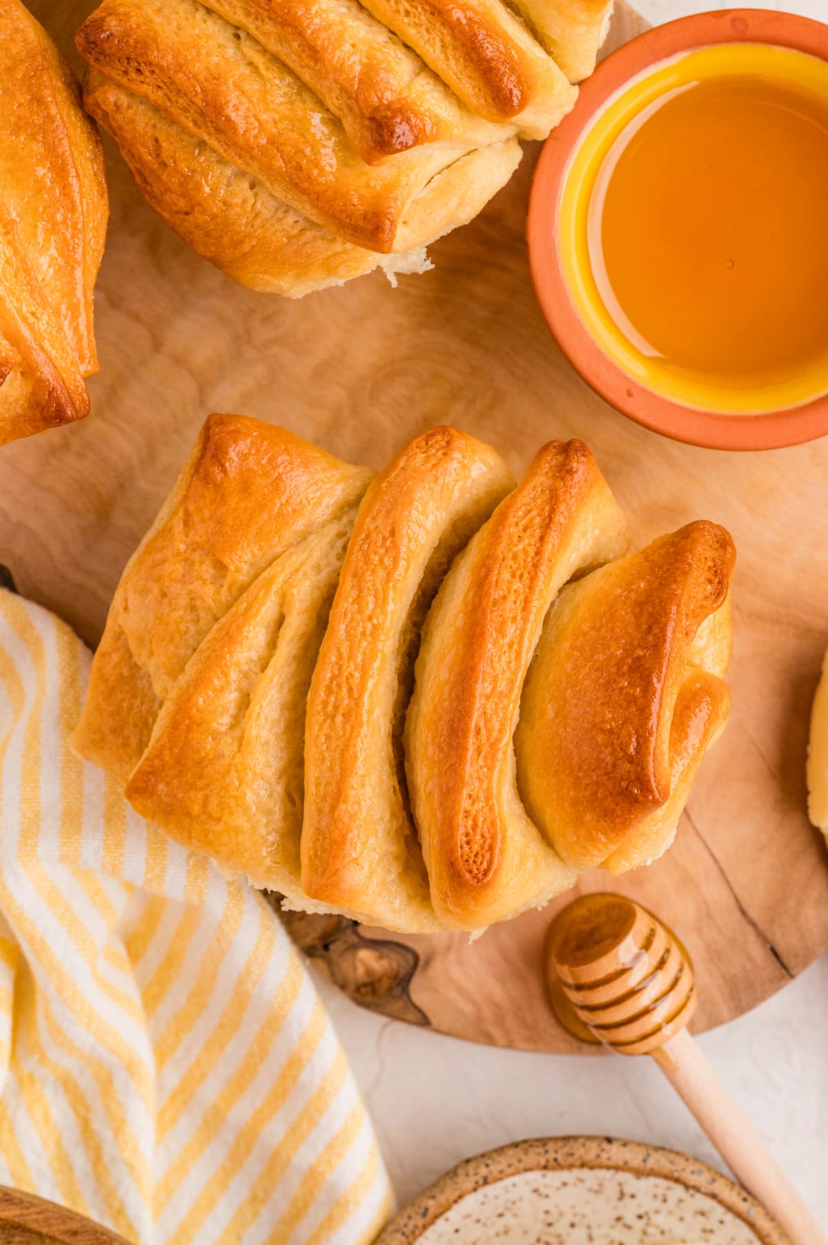 Soft honey butter pull-apart rolls. Overhead of pull-apart rolls with honey and butter.