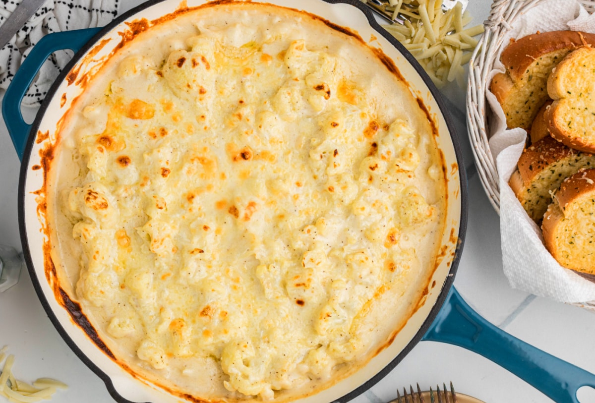 Cauliflower mac and cheese baked until golden, with a smooth cheese sauce and lightly browned top.