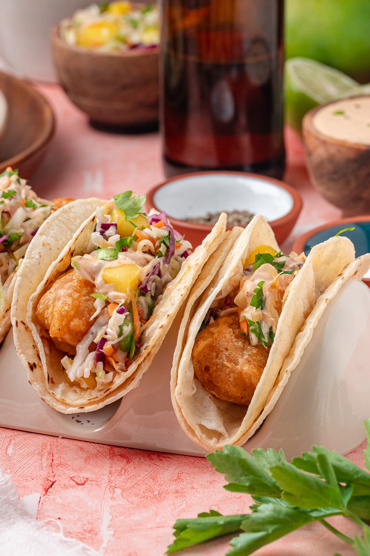 Crispy fried cod in warm corn tortillas with mango slaw and chipotle lime sauce.