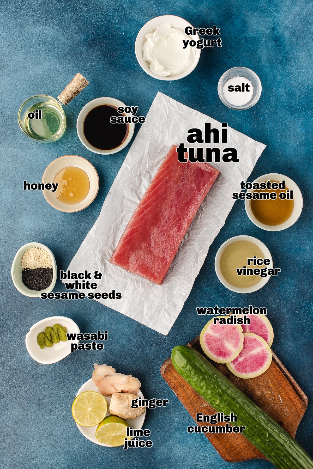 Raw ahi tuna steak with soy sauce, rice vinegar, sesame seeds, ginger, lime, cucumber, and watermelon radish