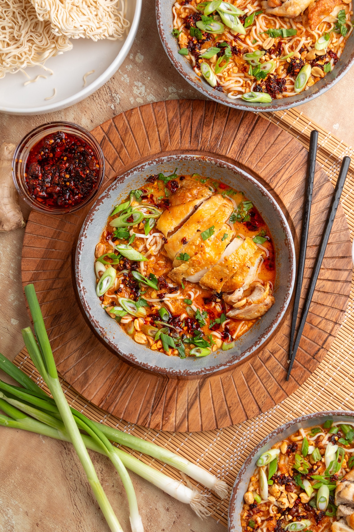 Overhead panang curry ramen with crispy chicken Overhead view of panang curry ramen with crispy chicken, coconut curry broth, ramen noodles, scallions, peanuts, and chili oil