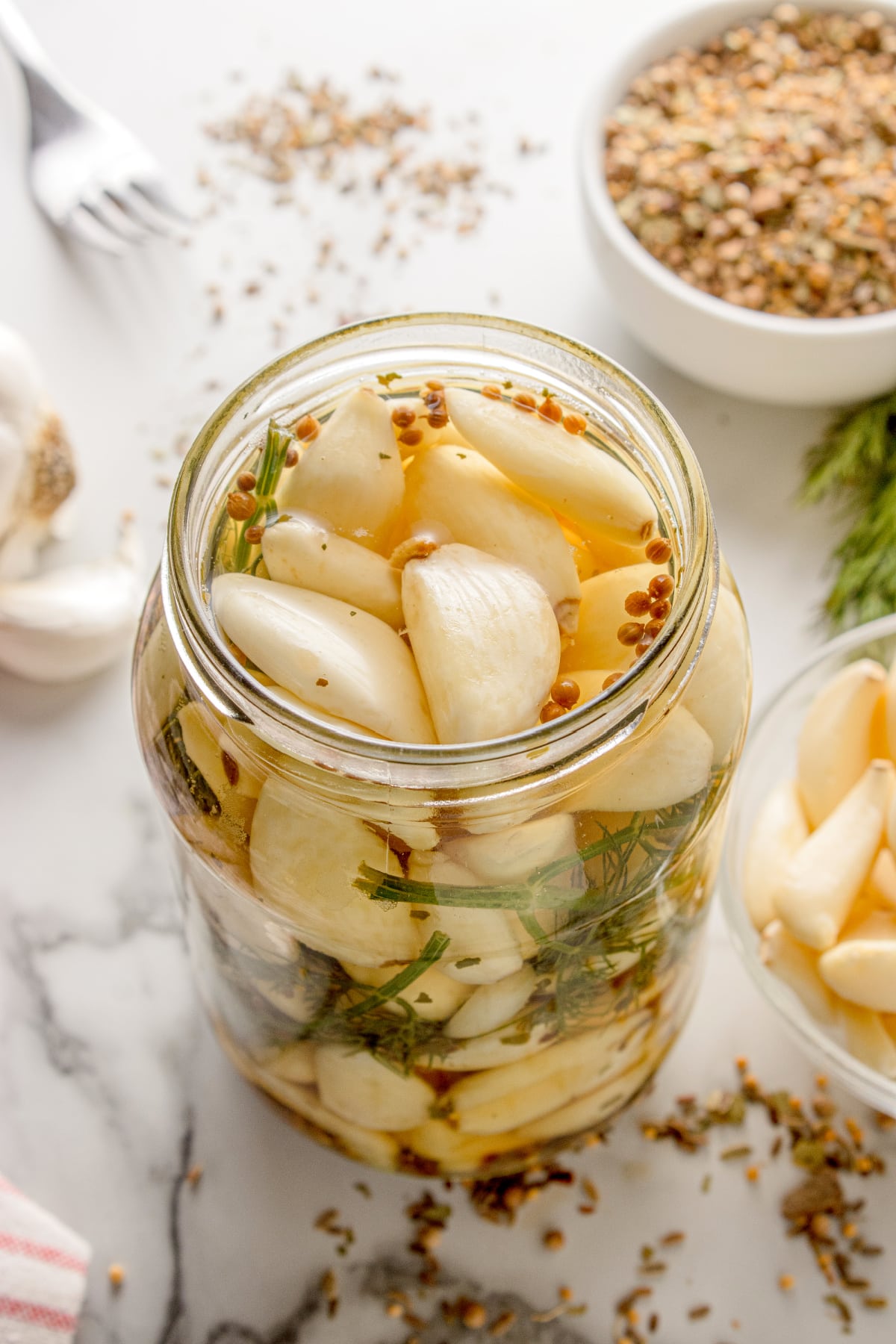 Pickled Dill Garlic Pickled Dill Garlic in a mason jar with dill and pickling spice