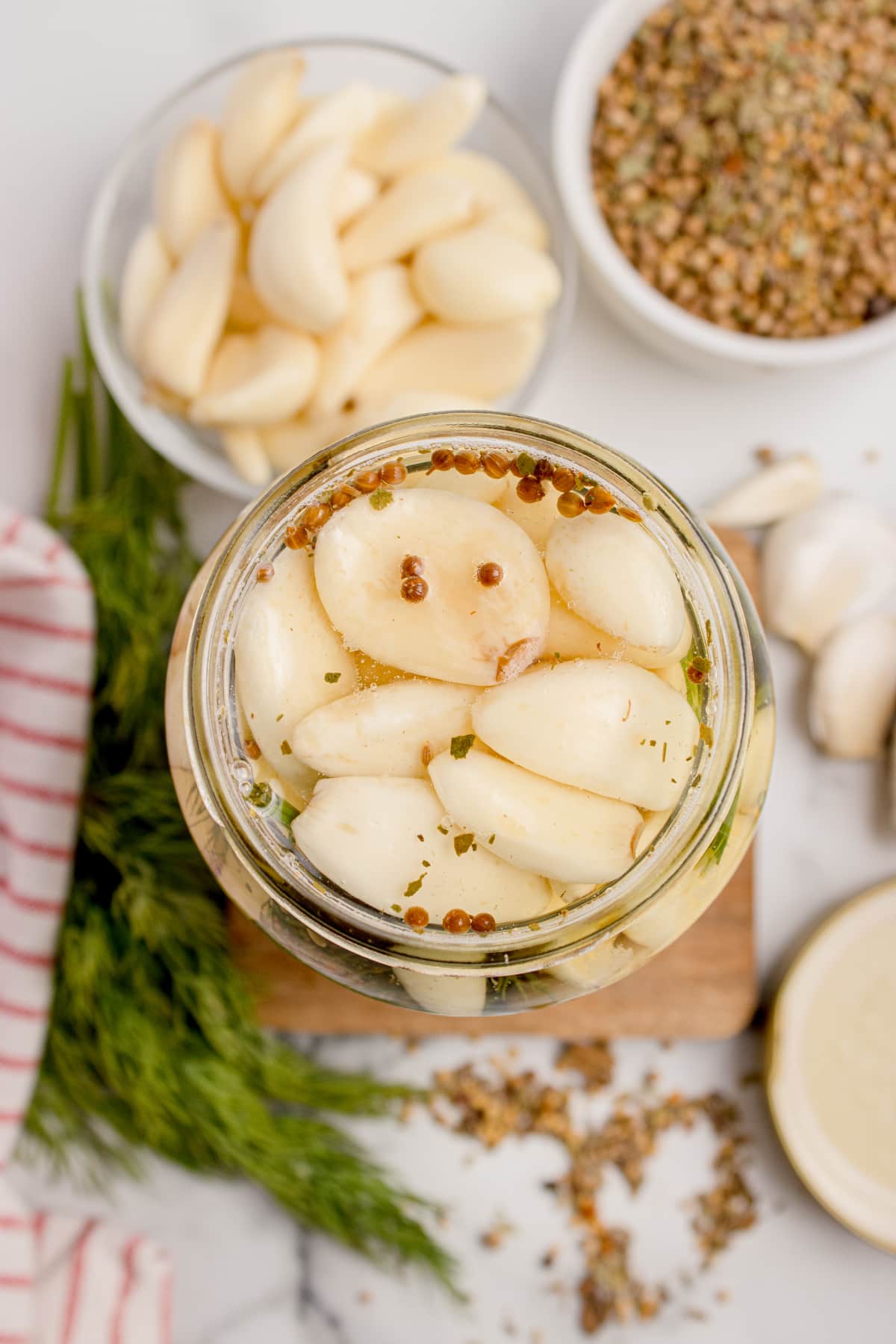 Refrigerator pickled garlic Overhead view of refrigerator pickled garlic cloves in brine